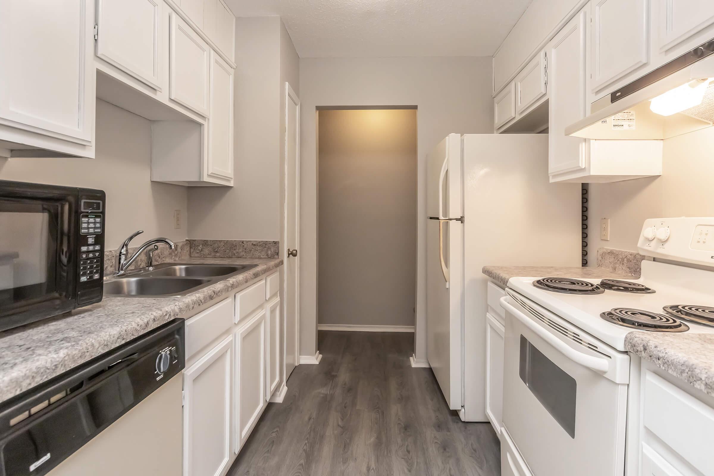 a kitchen with a stove and a sink