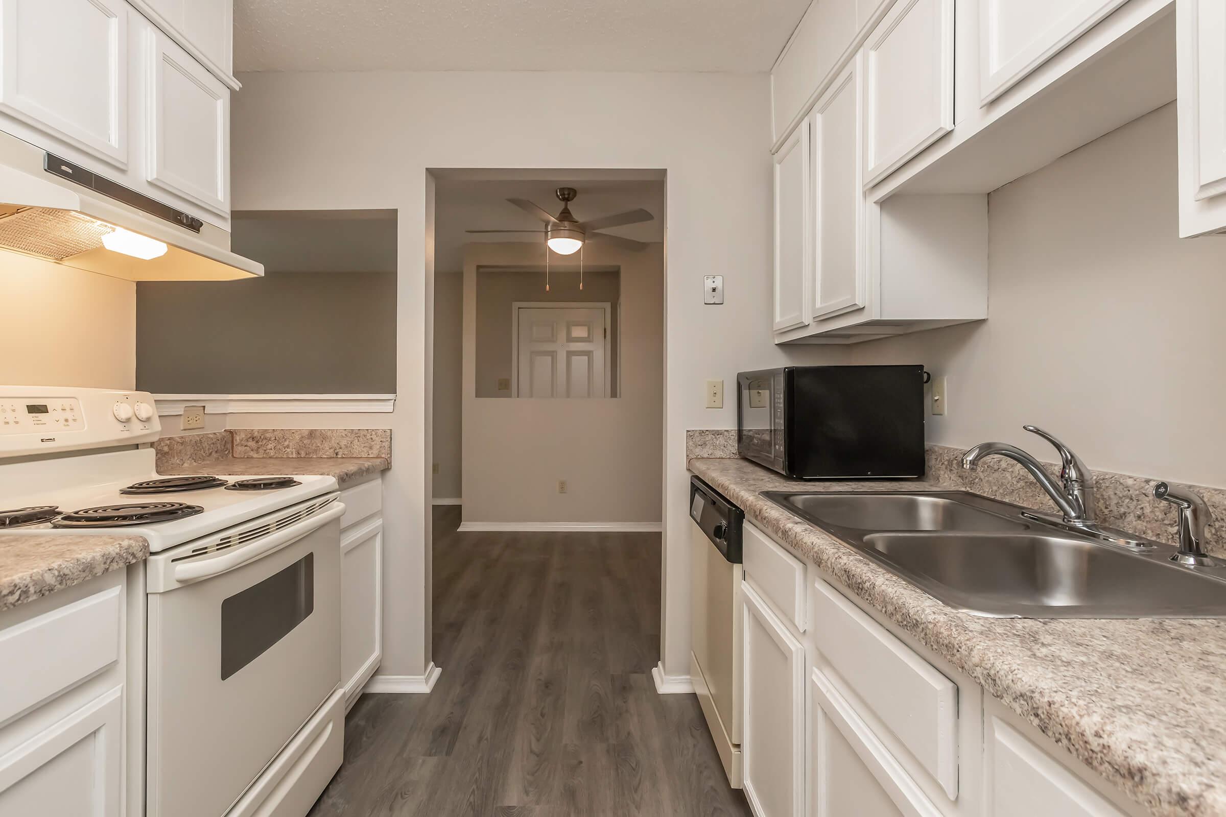 a kitchen with a stove and a sink