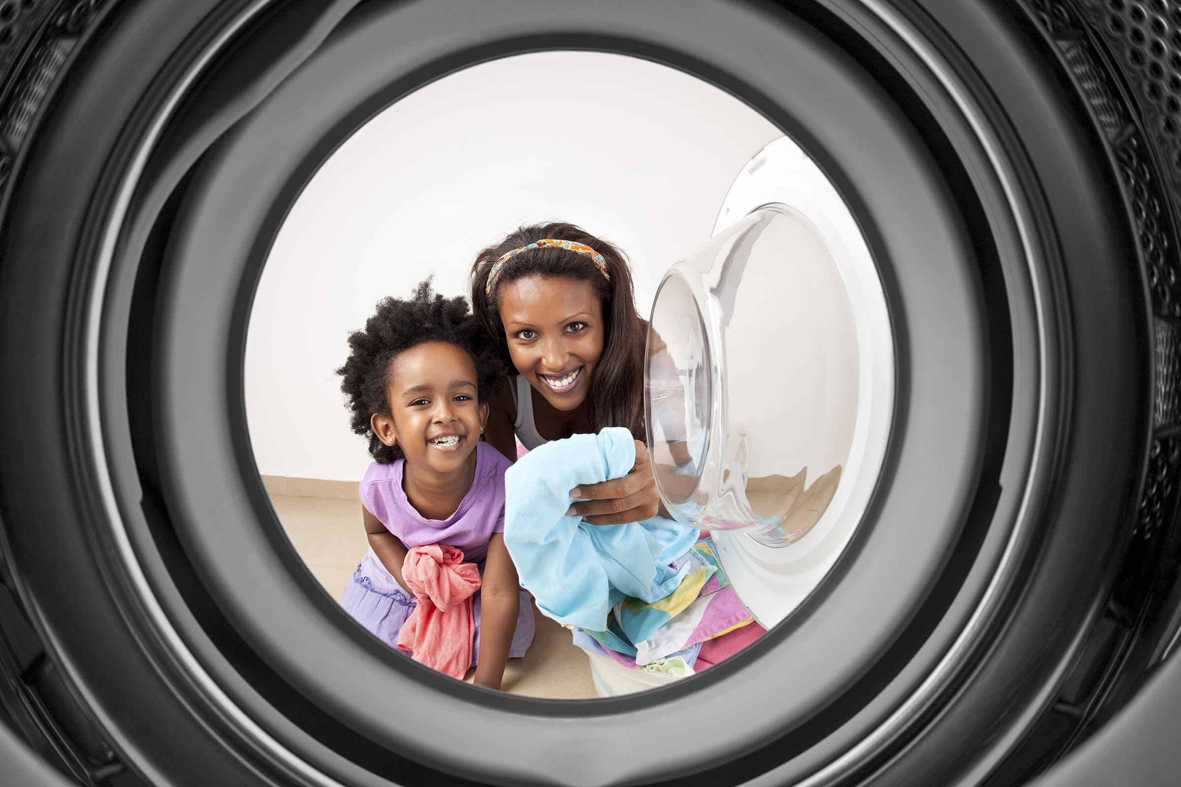 a washer in front of a mirror posing for the camera