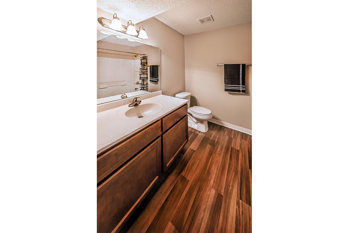 a kitchen with a sink and a mirror