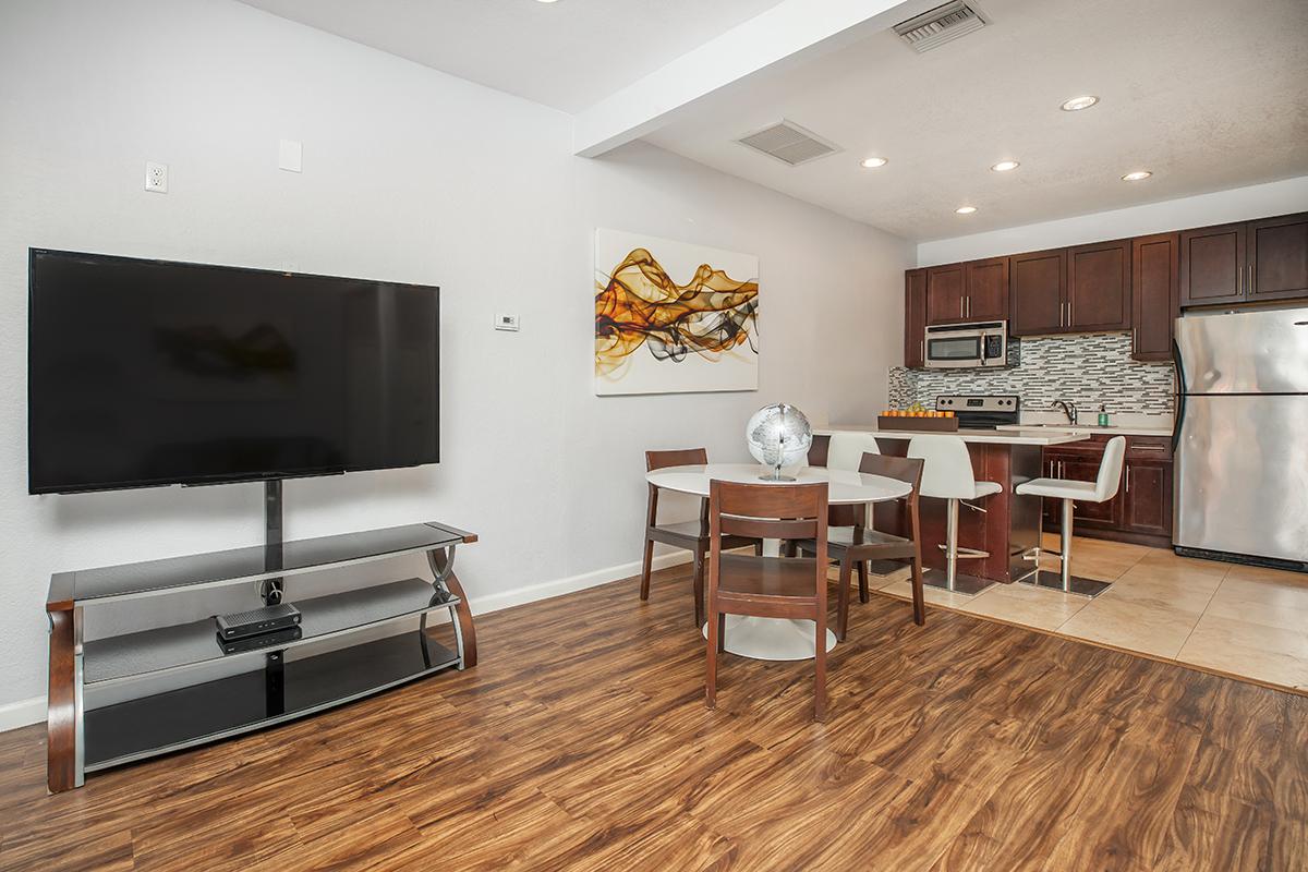 a room filled with furniture and a wood floor