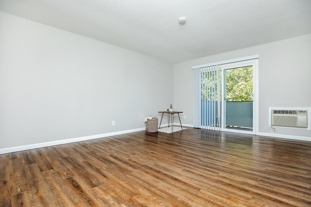 a living room with a wooden floor