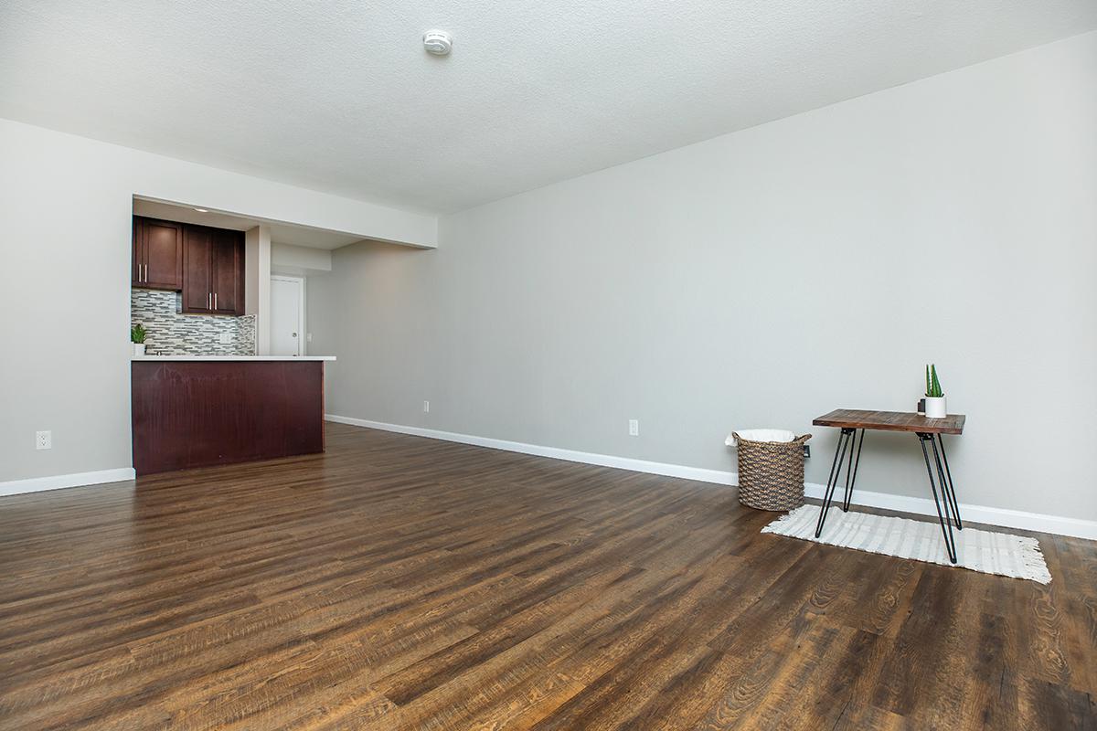 a large empty room with a wooden floor