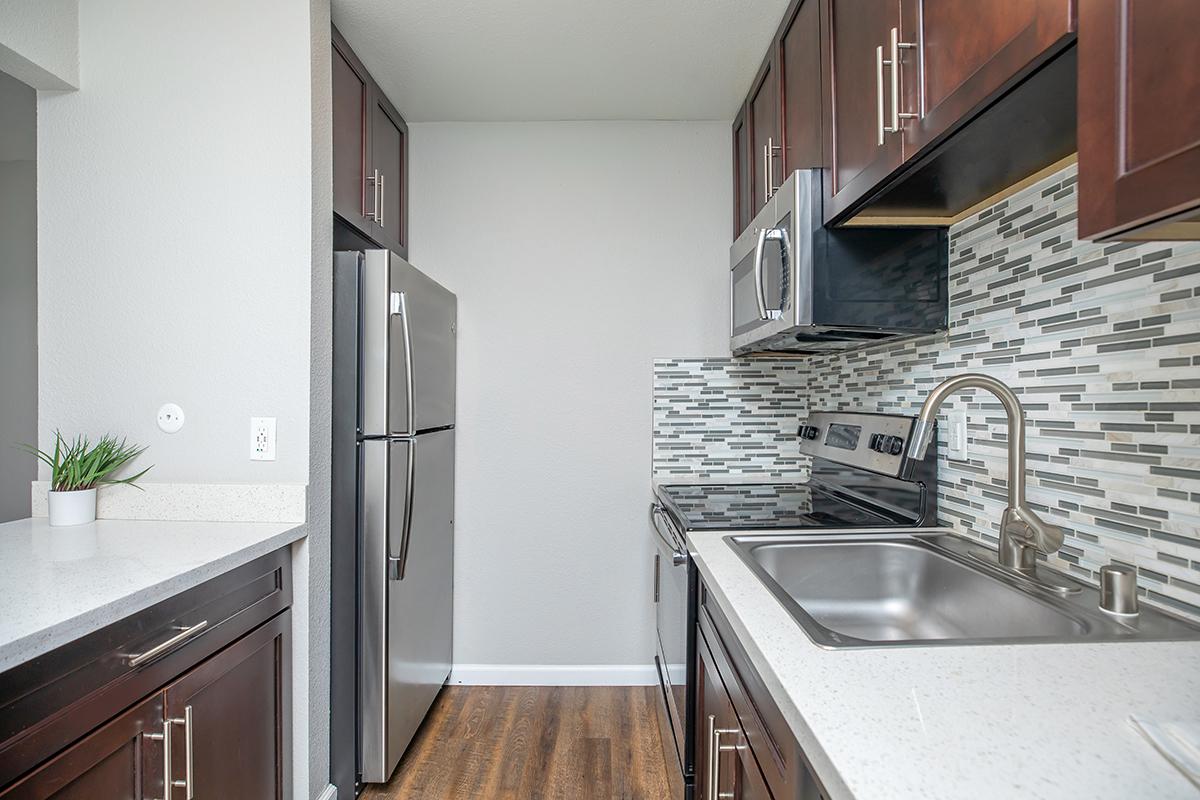 a kitchen with a stove top oven sitting inside of a building