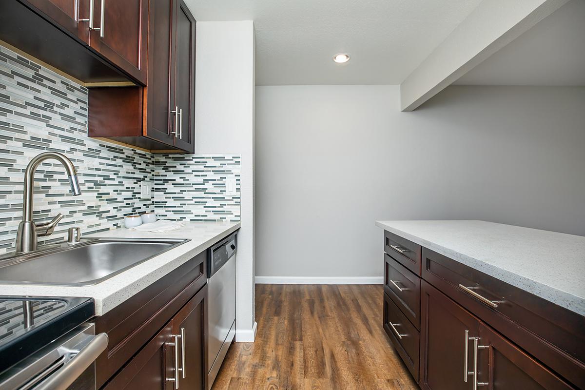 a kitchen with a stove top oven