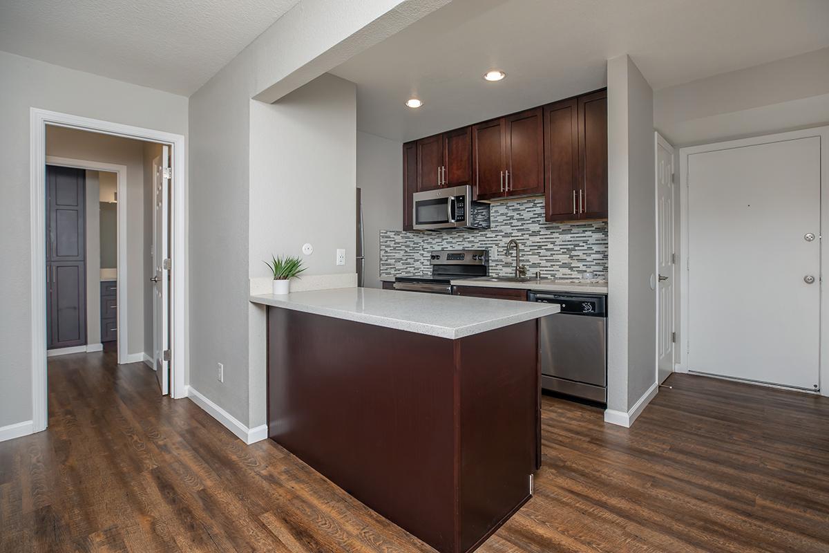 a kitchen with a wood floor