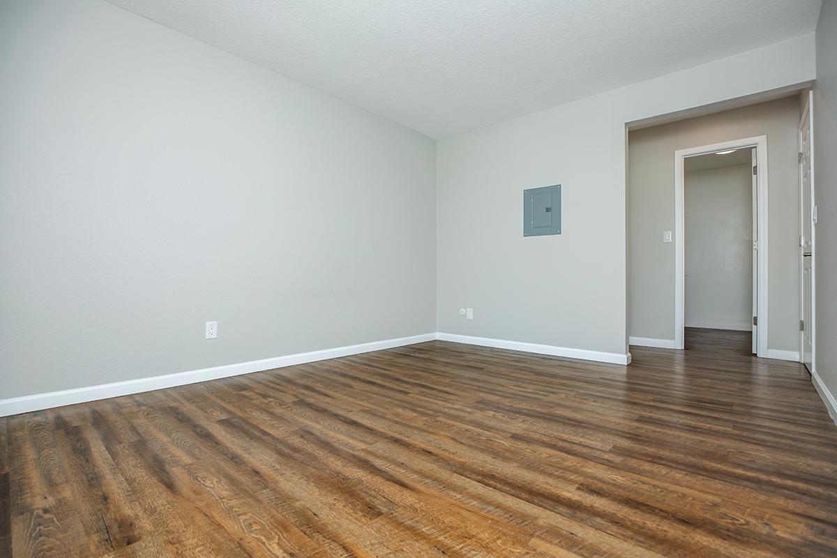 a large empty room with a wooden floor