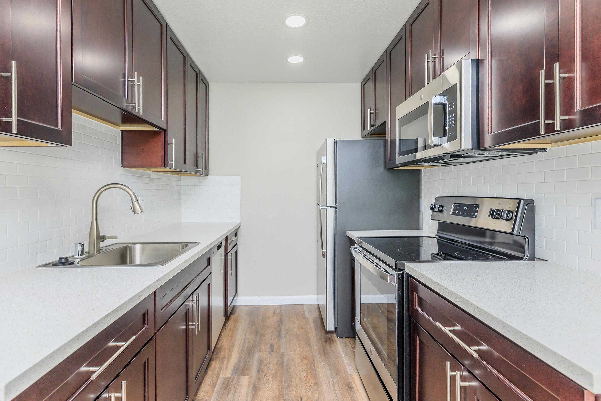 a modern kitchen with stainless steel appliances