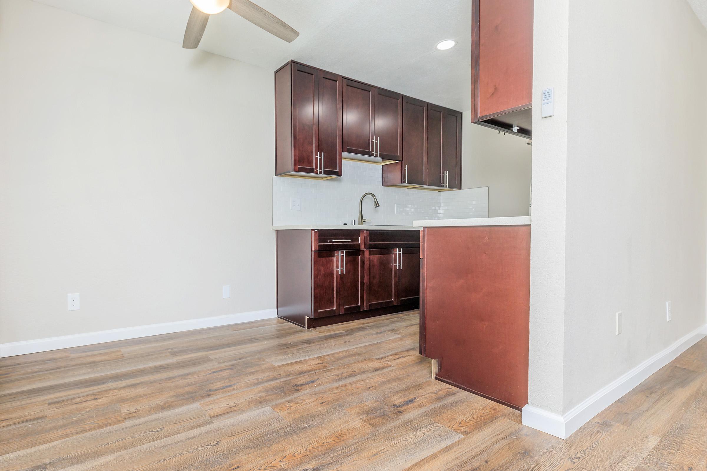 a kitchen with a wooden floor