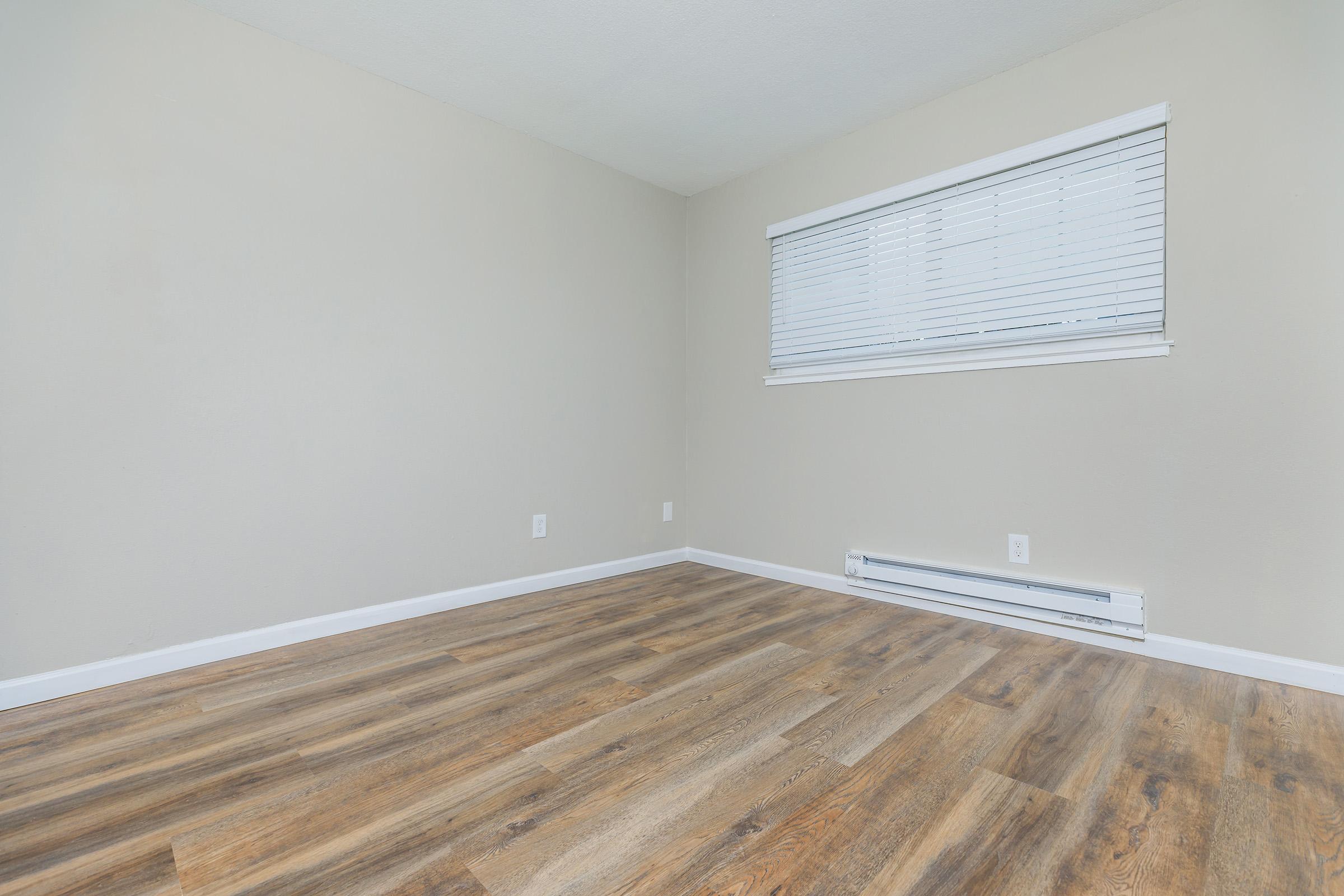 a bedroom with a large window