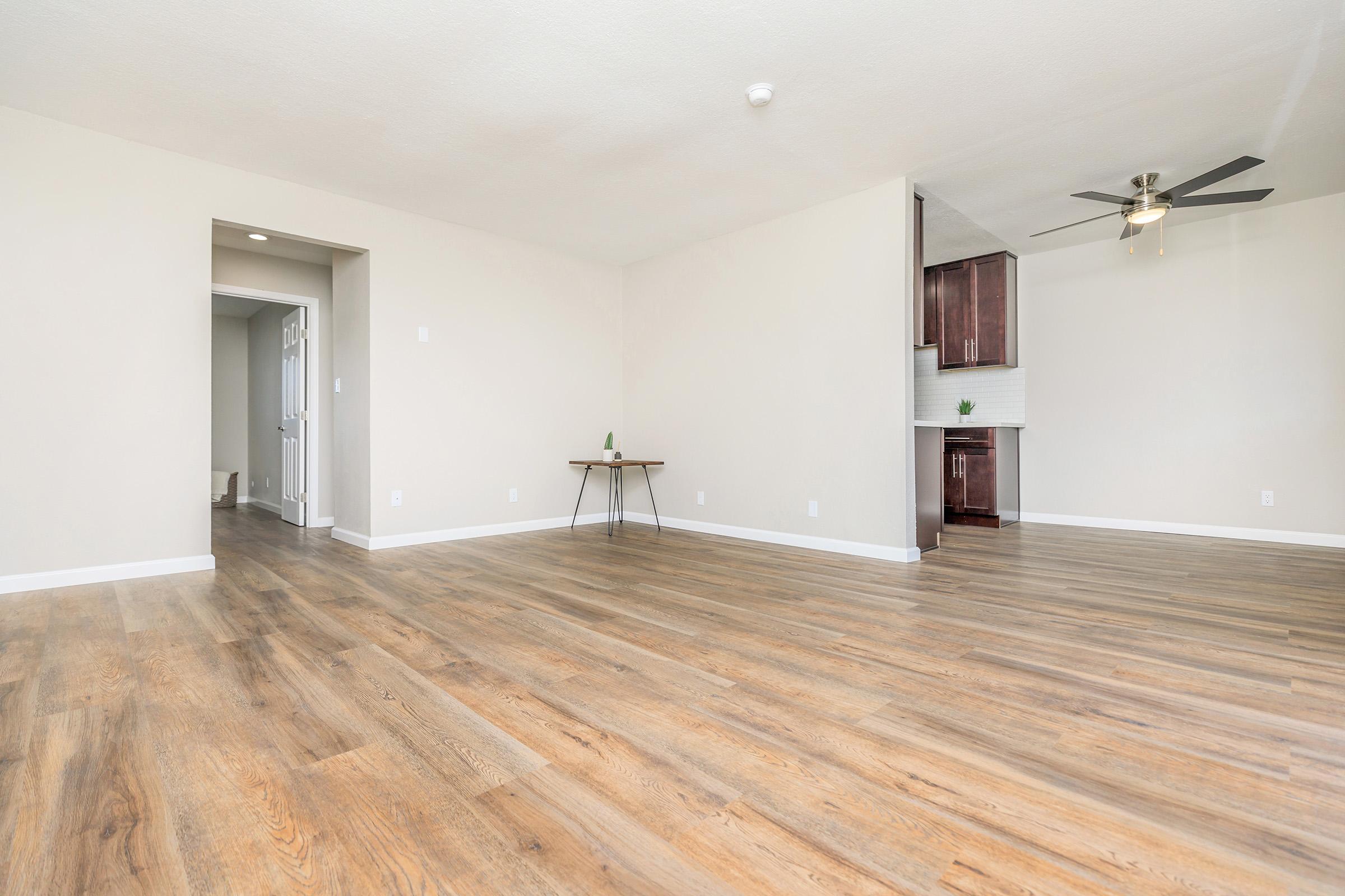 a large empty room with a wooden floor