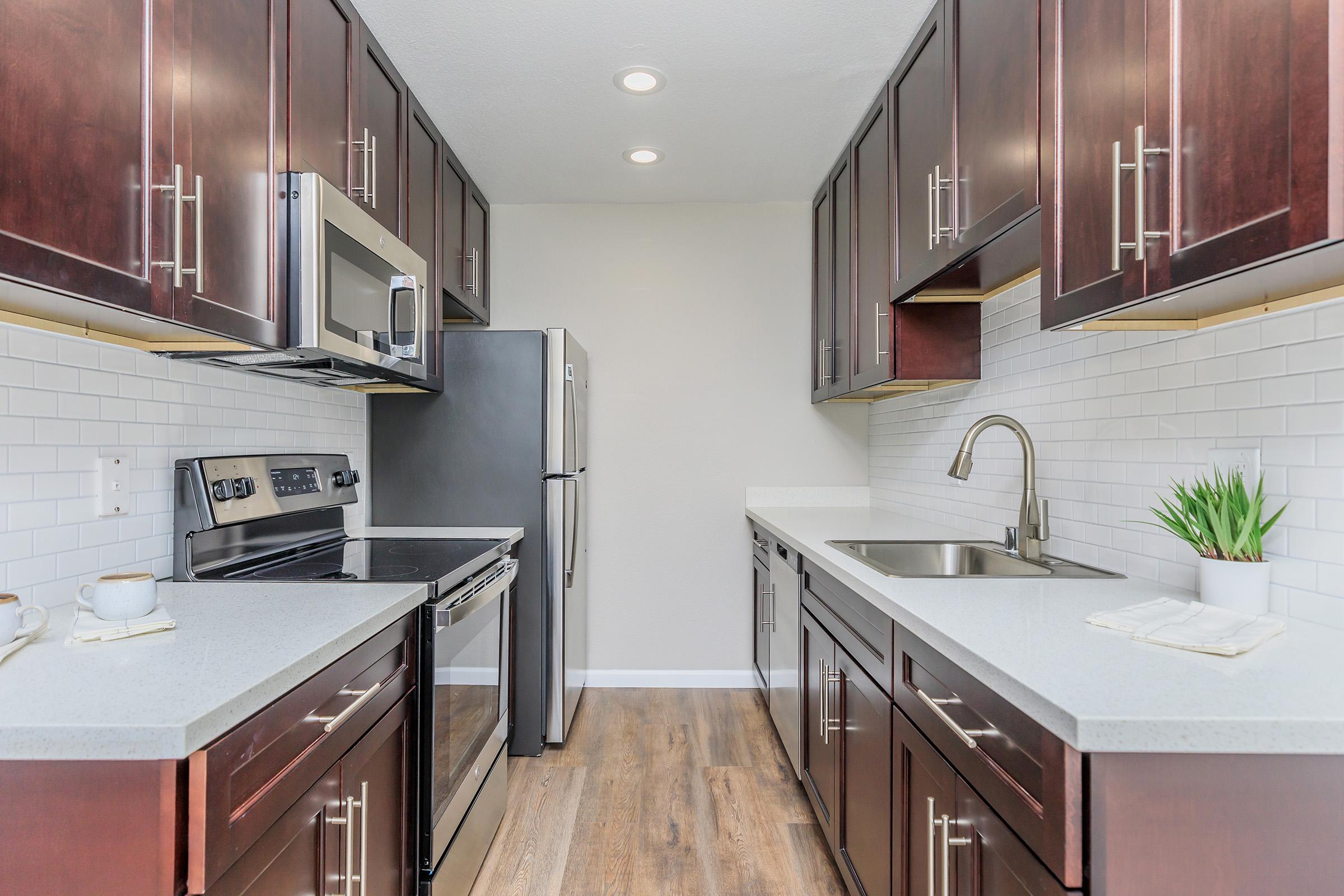 a modern kitchen with stainless steel appliances