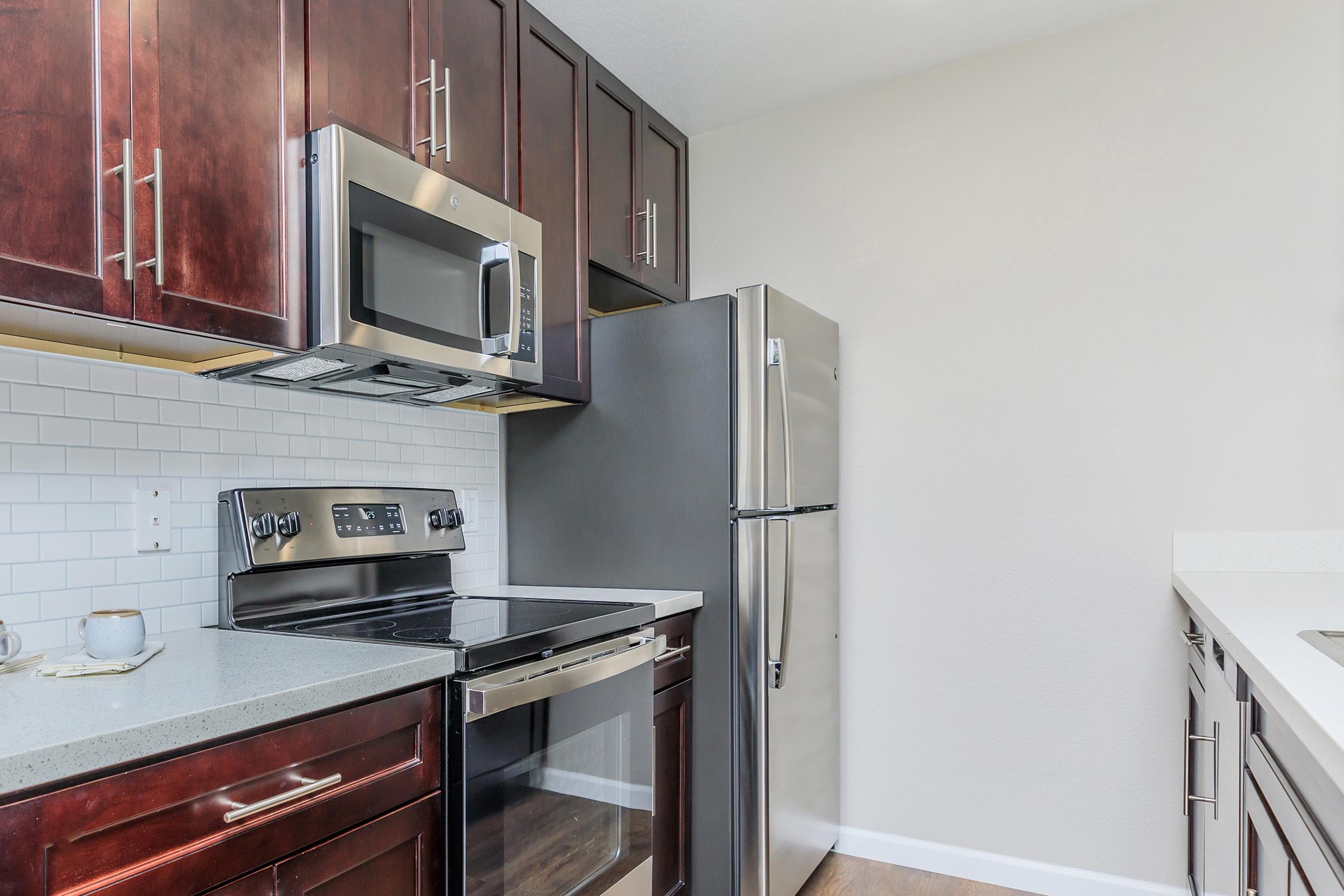 a stainless steel refrigerator in a kitchen