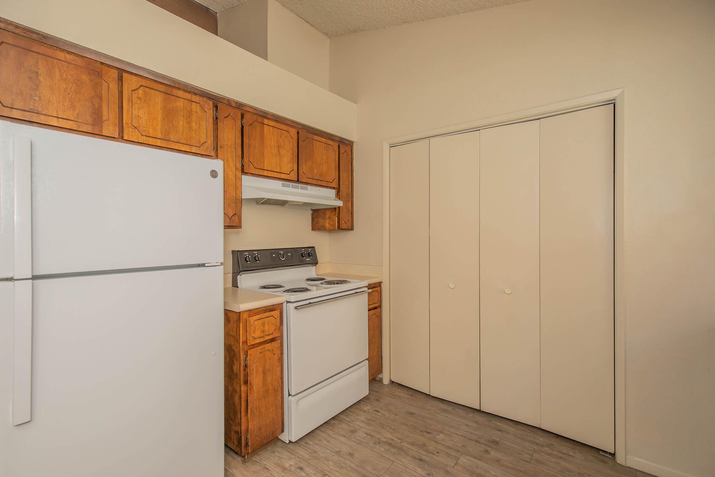 a kitchen with a stove top oven sitting inside of a refrigerator