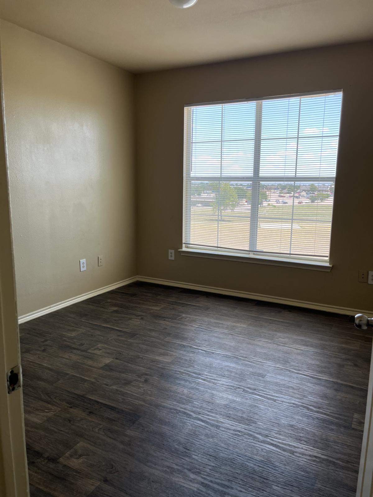 Bright and inviting, this spacious room features large windows that fill the space with natural light, perfect for creating your dream home in our welcoming community.