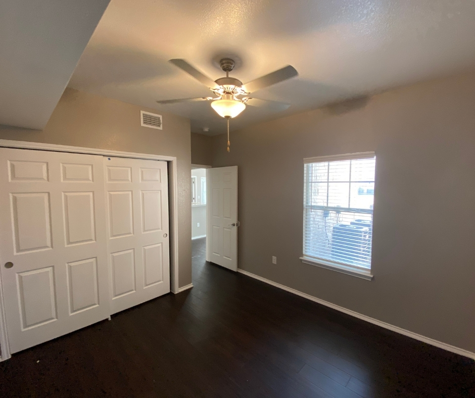 Bedroom with wooden floors