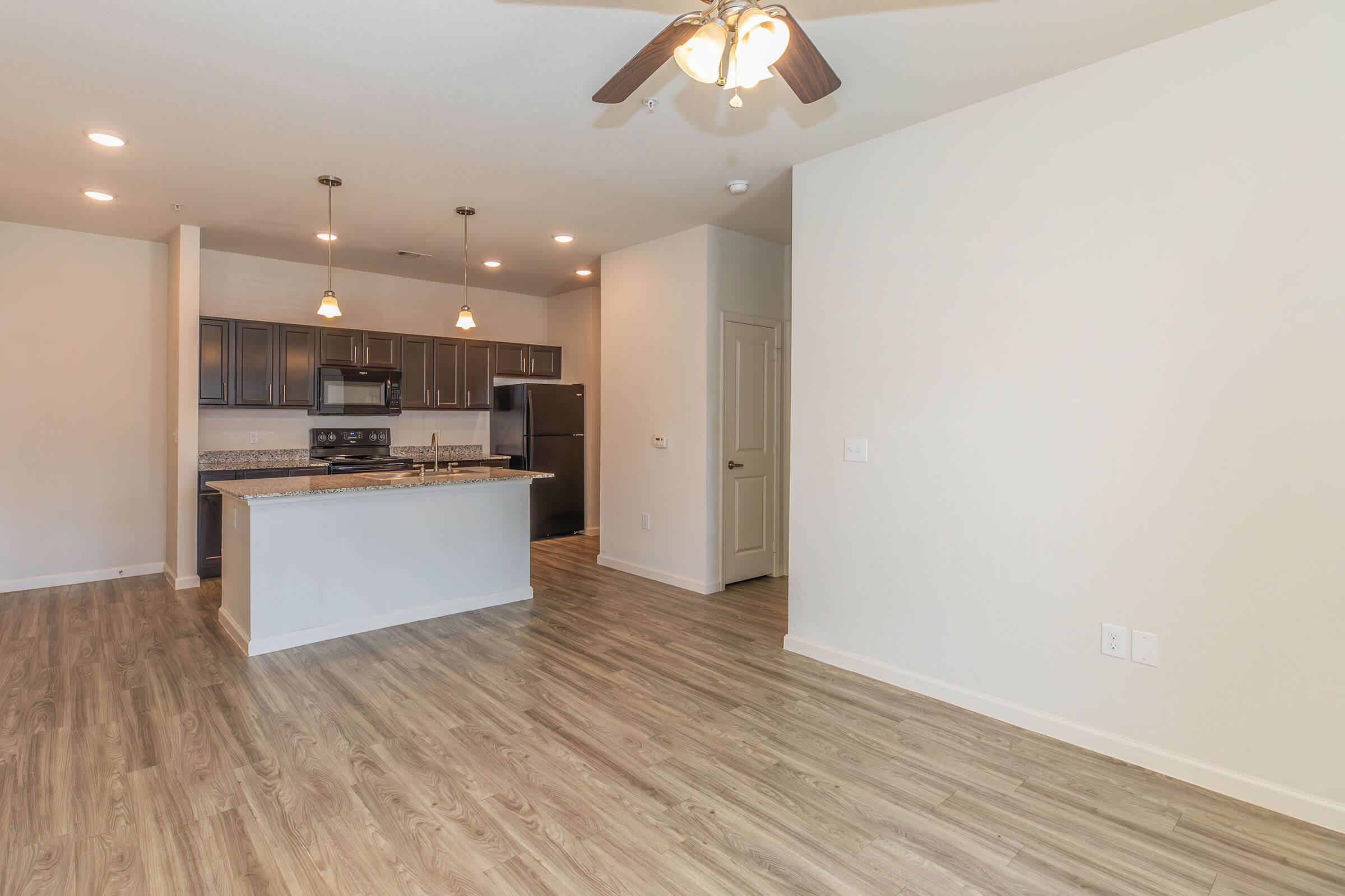 a kitchen with a wood floor