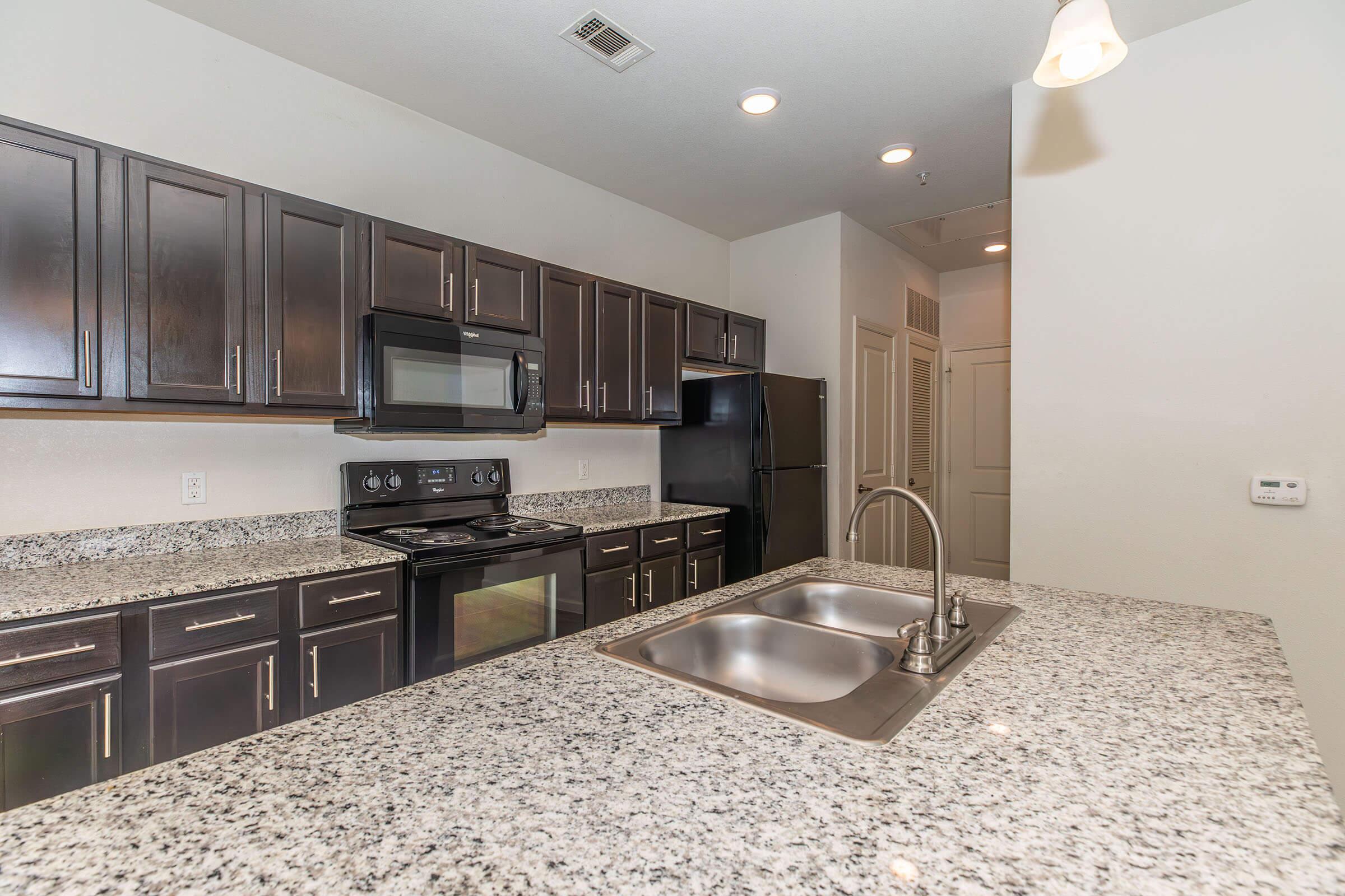 a modern kitchen with stainless steel appliances