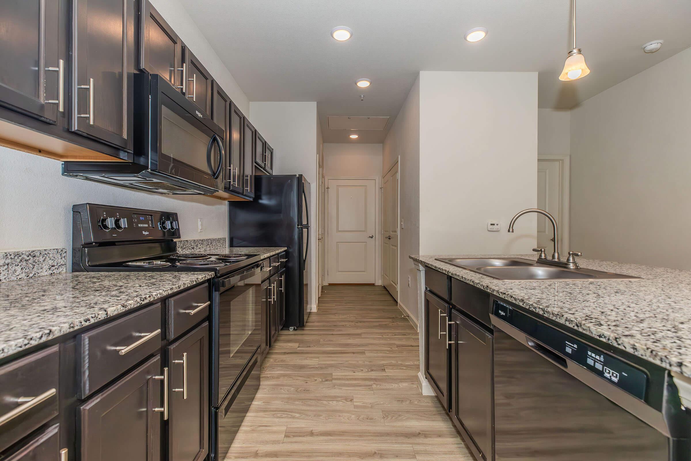 a modern kitchen with stainless steel appliances