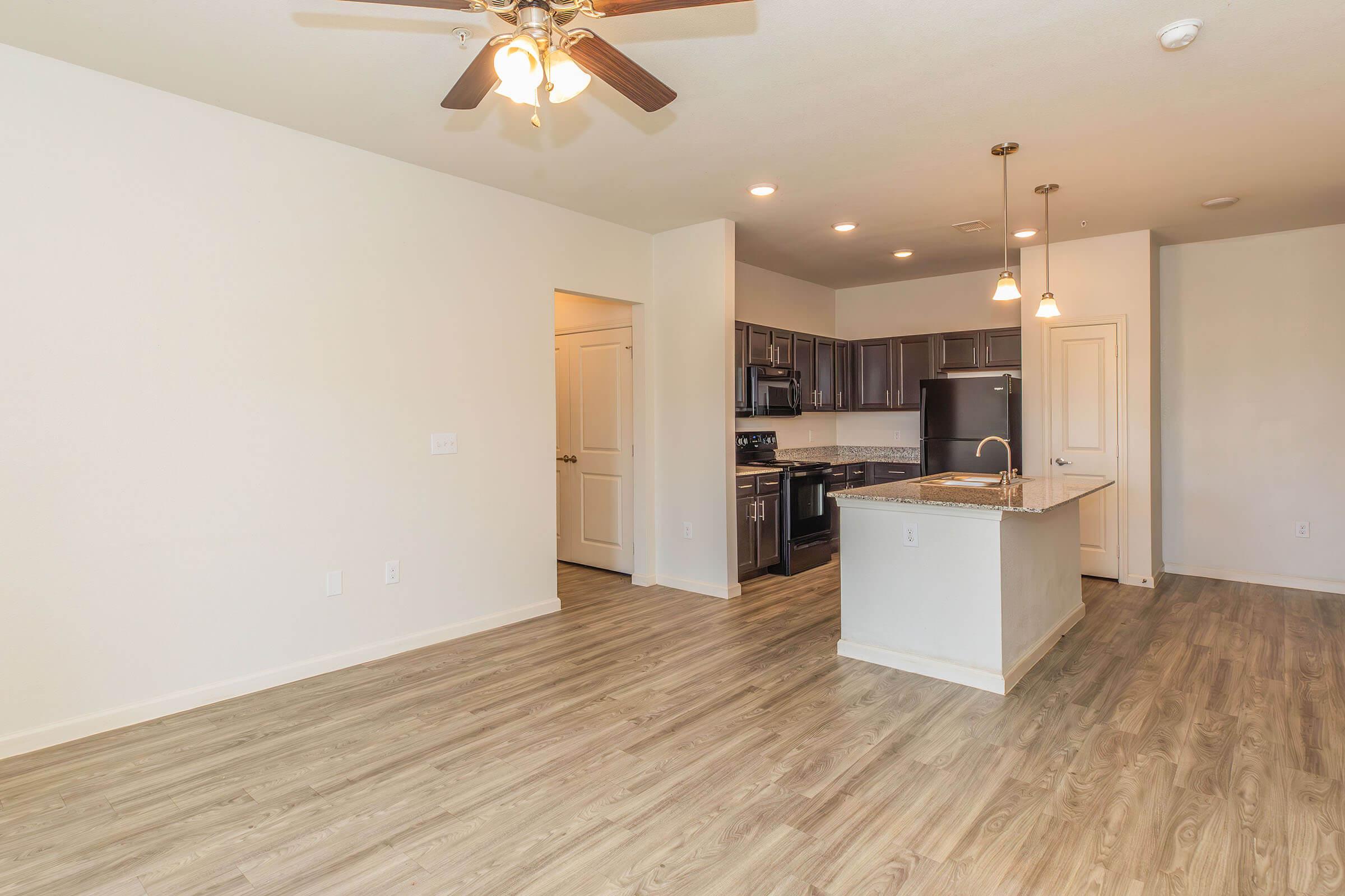 a kitchen with a wood floor