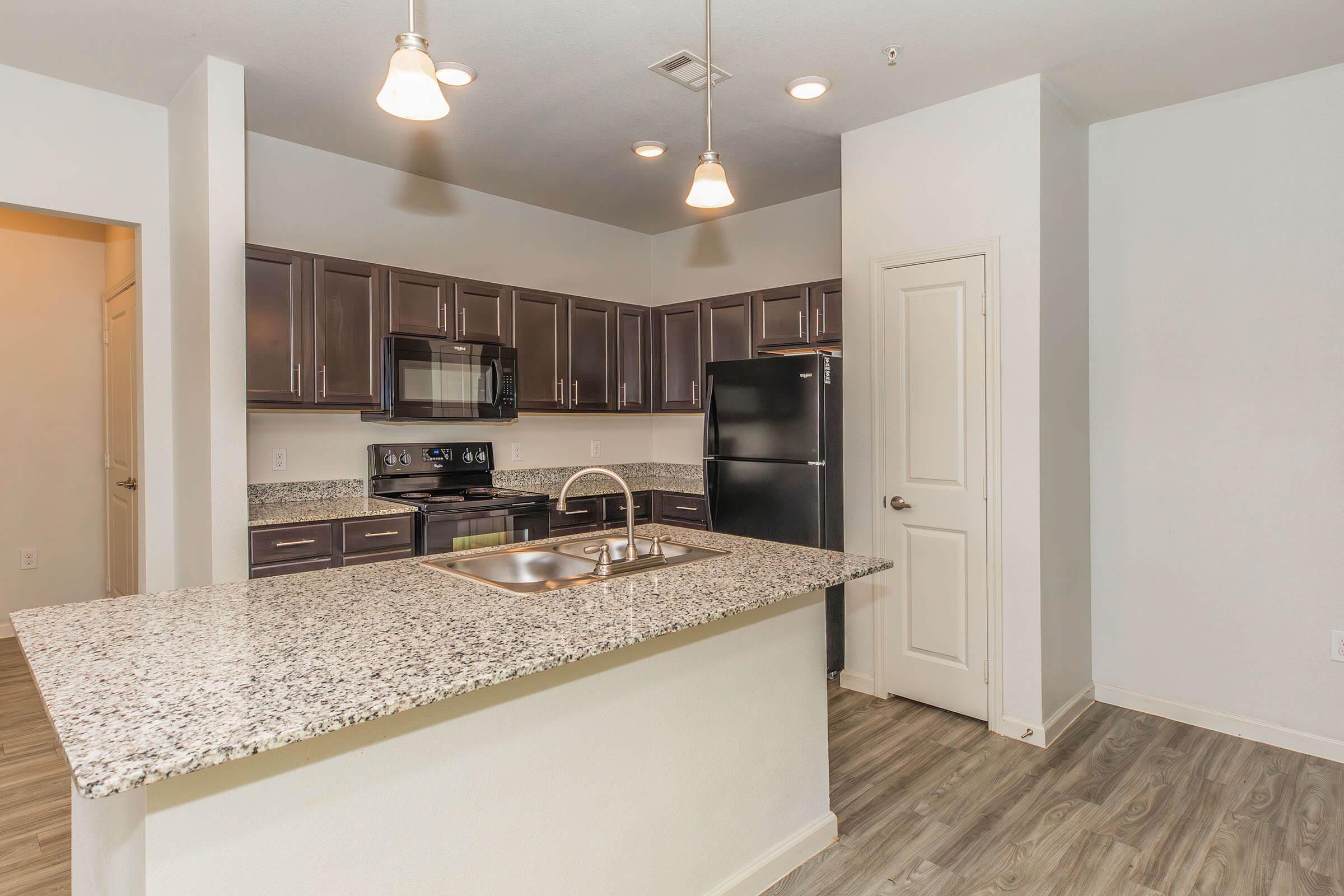 a large kitchen with stainless steel appliances