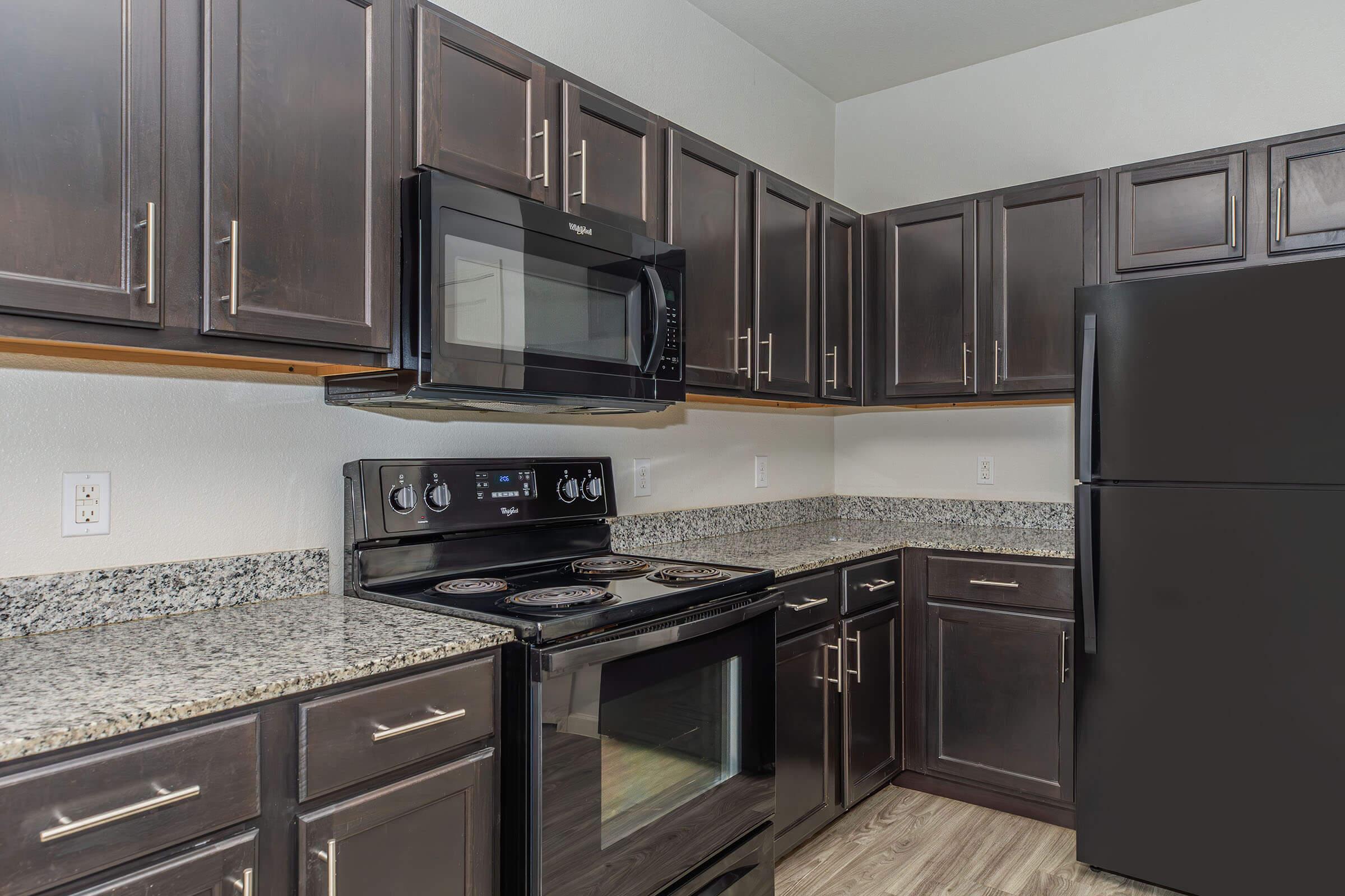 a large kitchen with stainless steel appliances