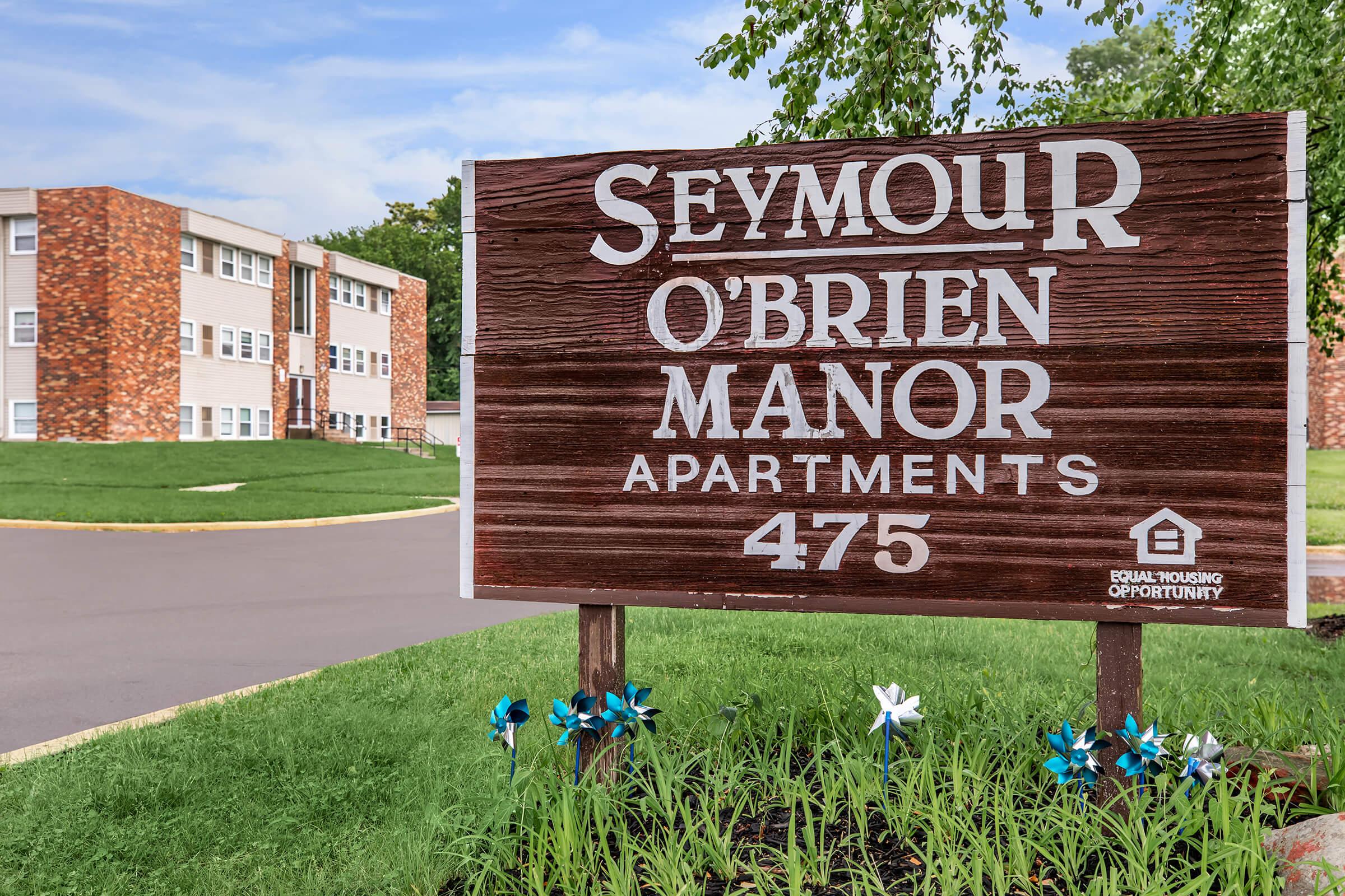 a sign in front of a building