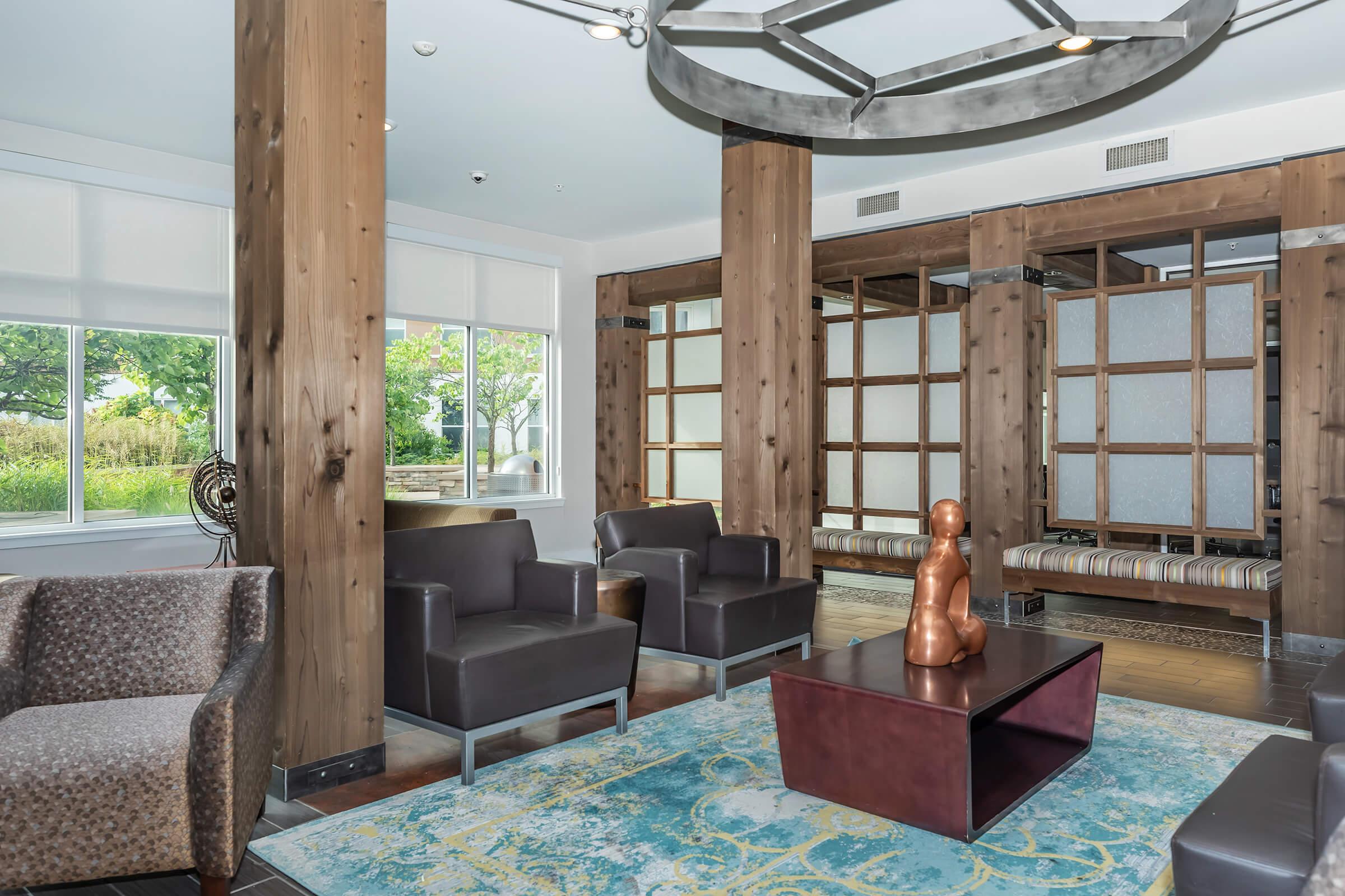 a living room filled with furniture and a large window