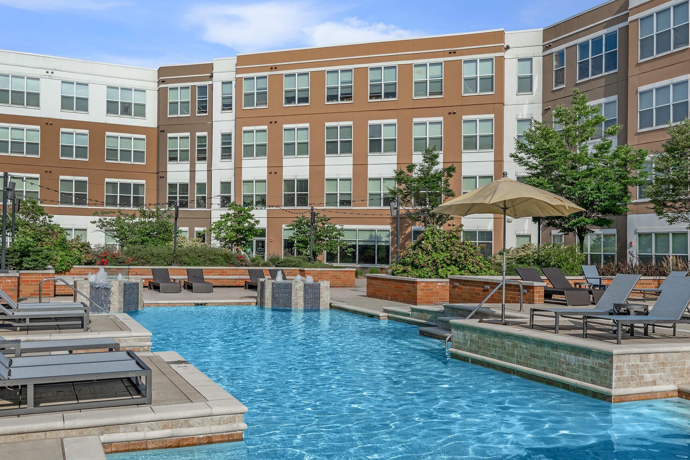 a large pool of water in front of a building