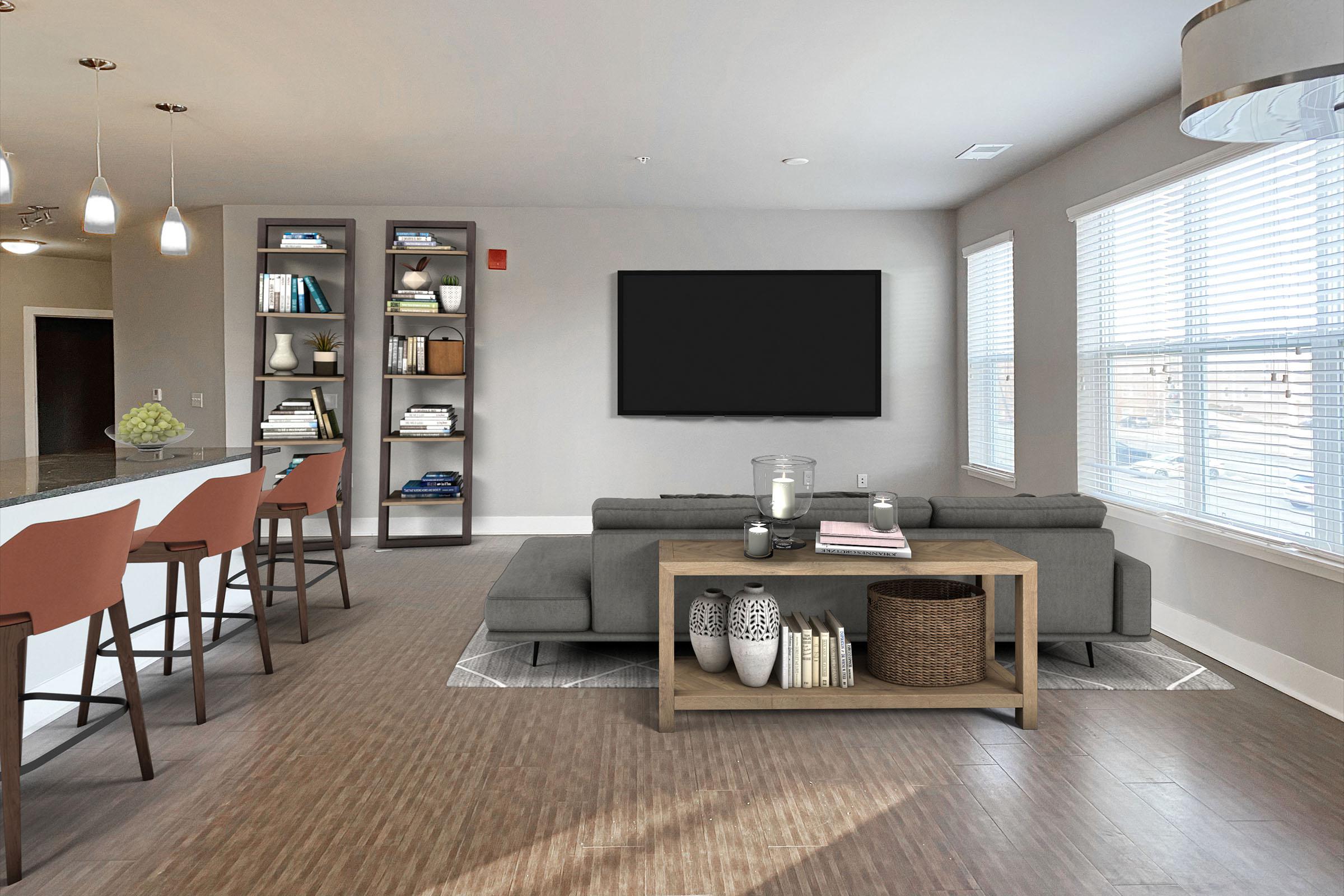 a living room filled with furniture and a large window