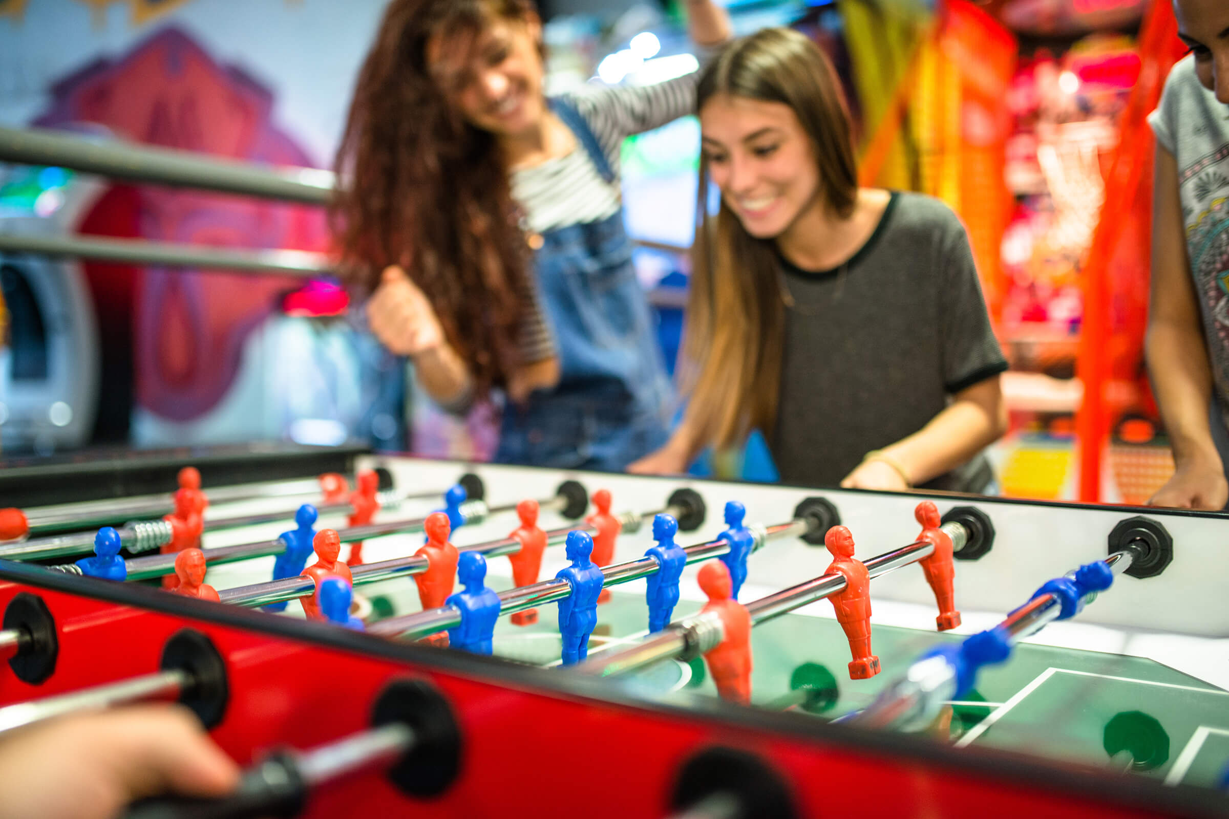 a group of people looking at a toy