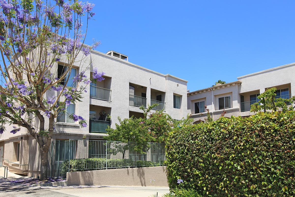 Valley Village Senior Apartment Homes community building with green landscaping