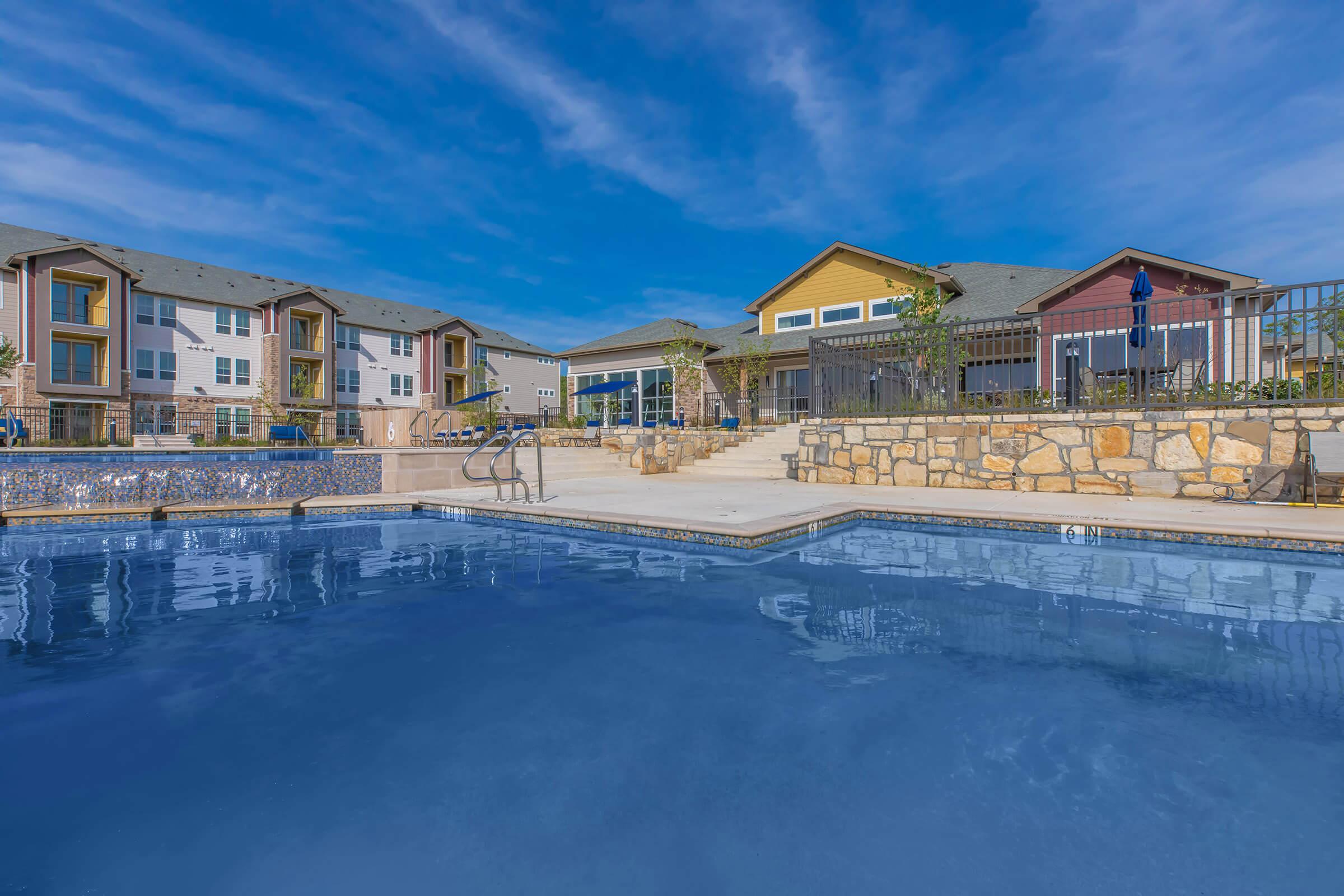 a house with a large pool of water