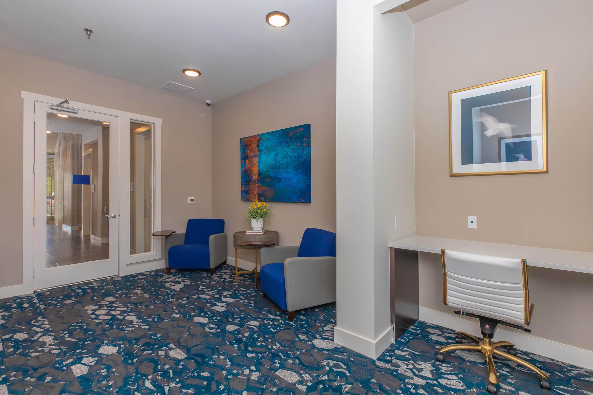 a living room filled with furniture and a rug