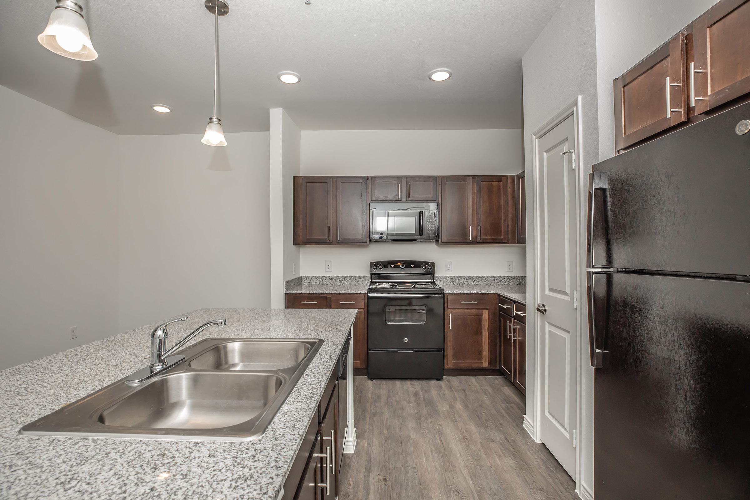 a modern kitchen with stainless steel appliances