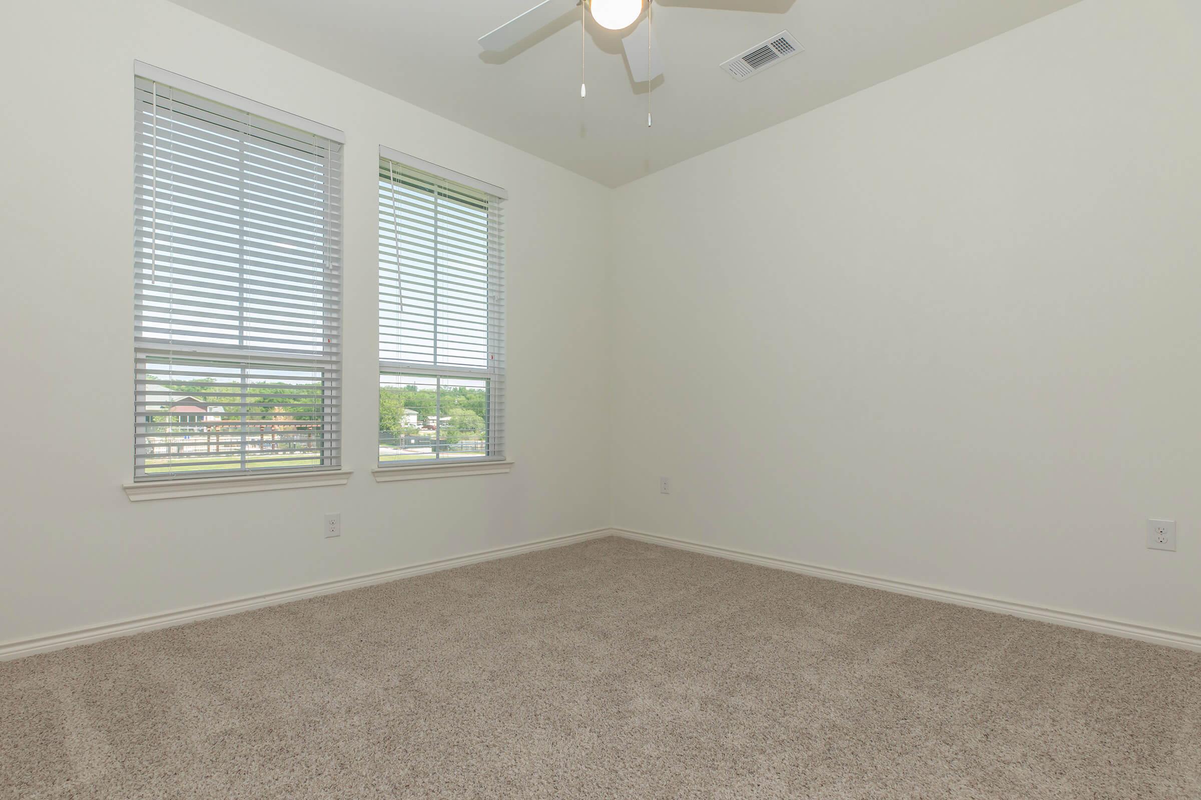 a bedroom with a large window