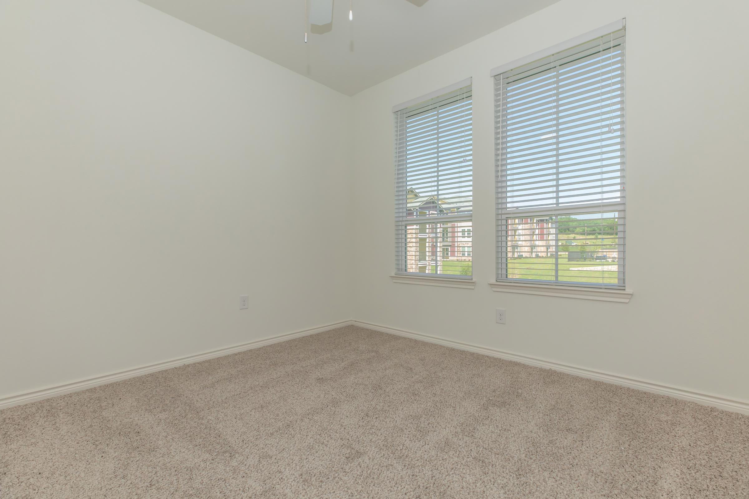 a bedroom with a large window