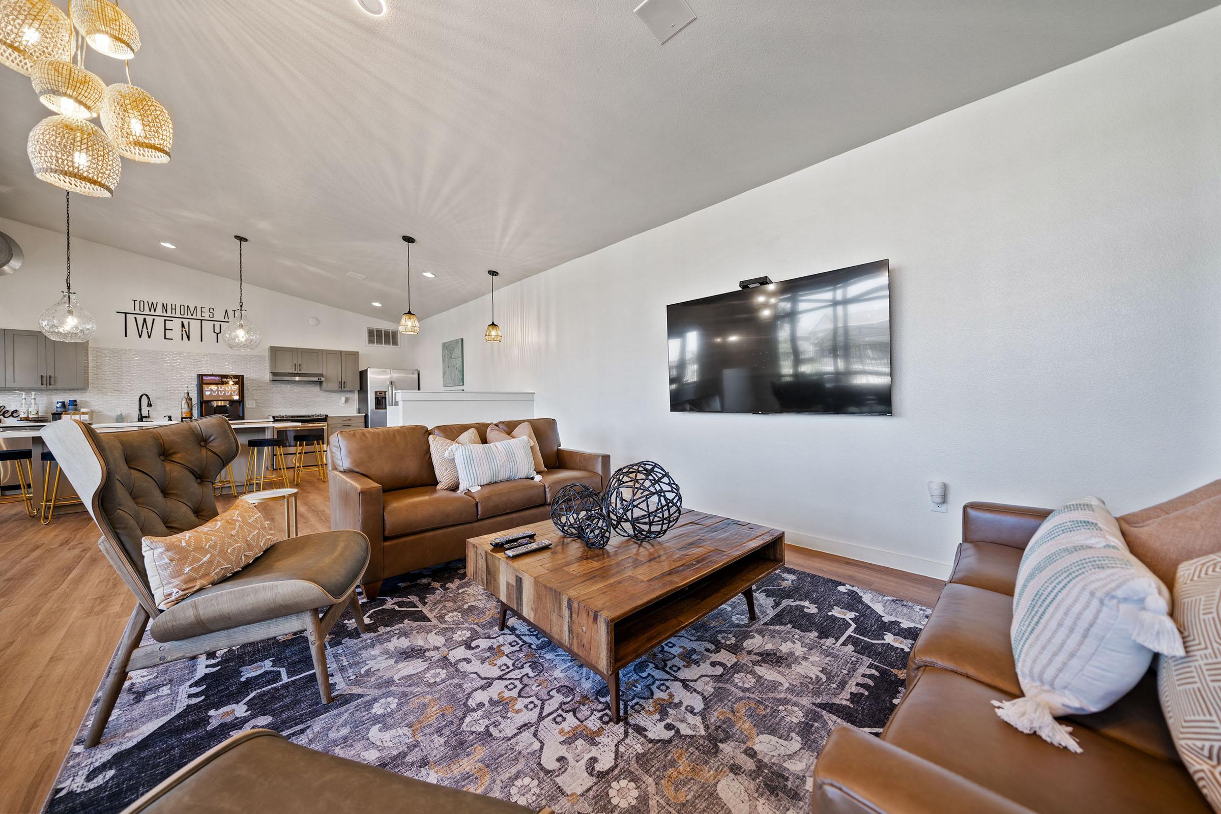 a living room filled with furniture and a table