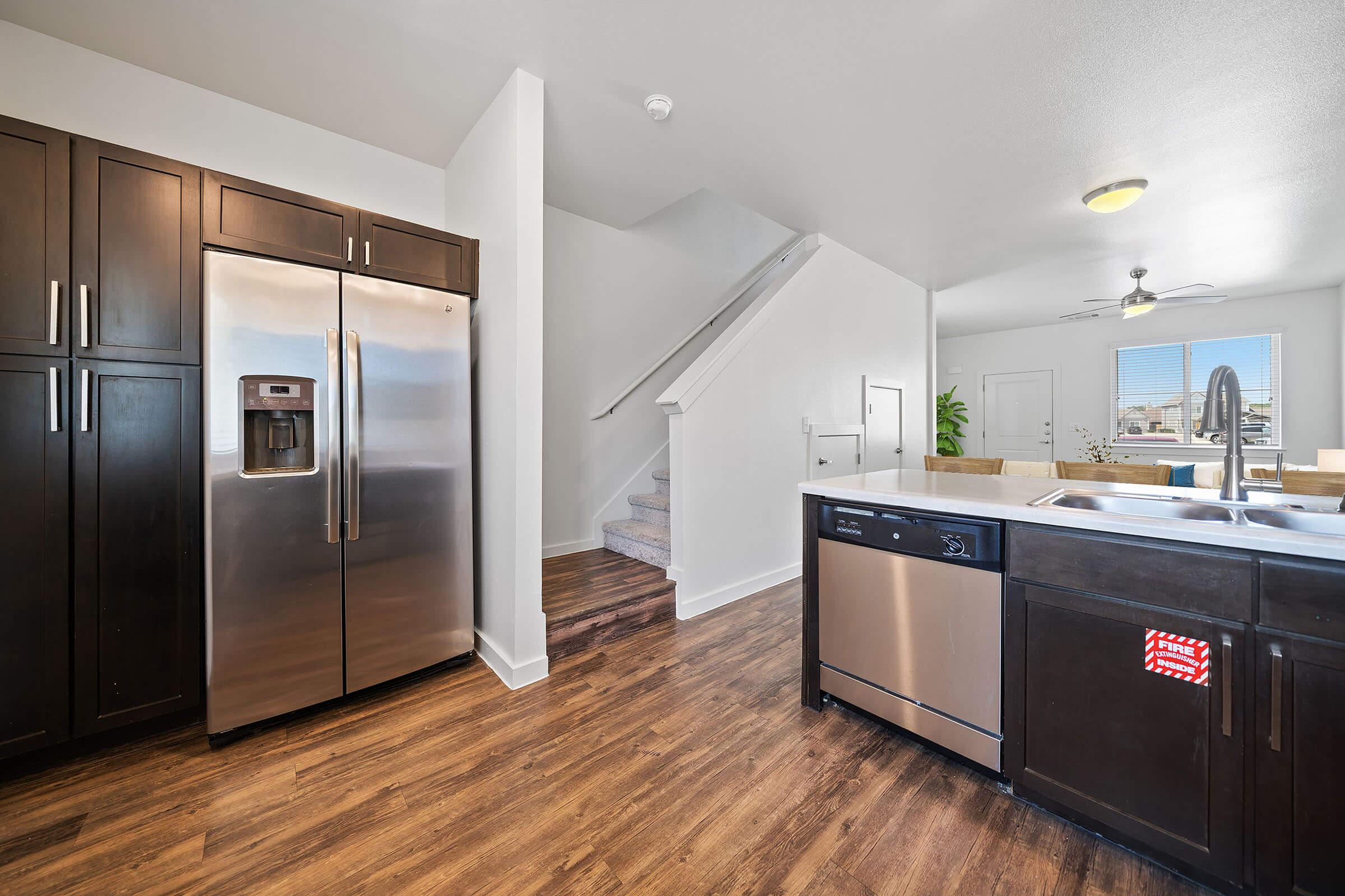 a large kitchen with stainless steel appliances