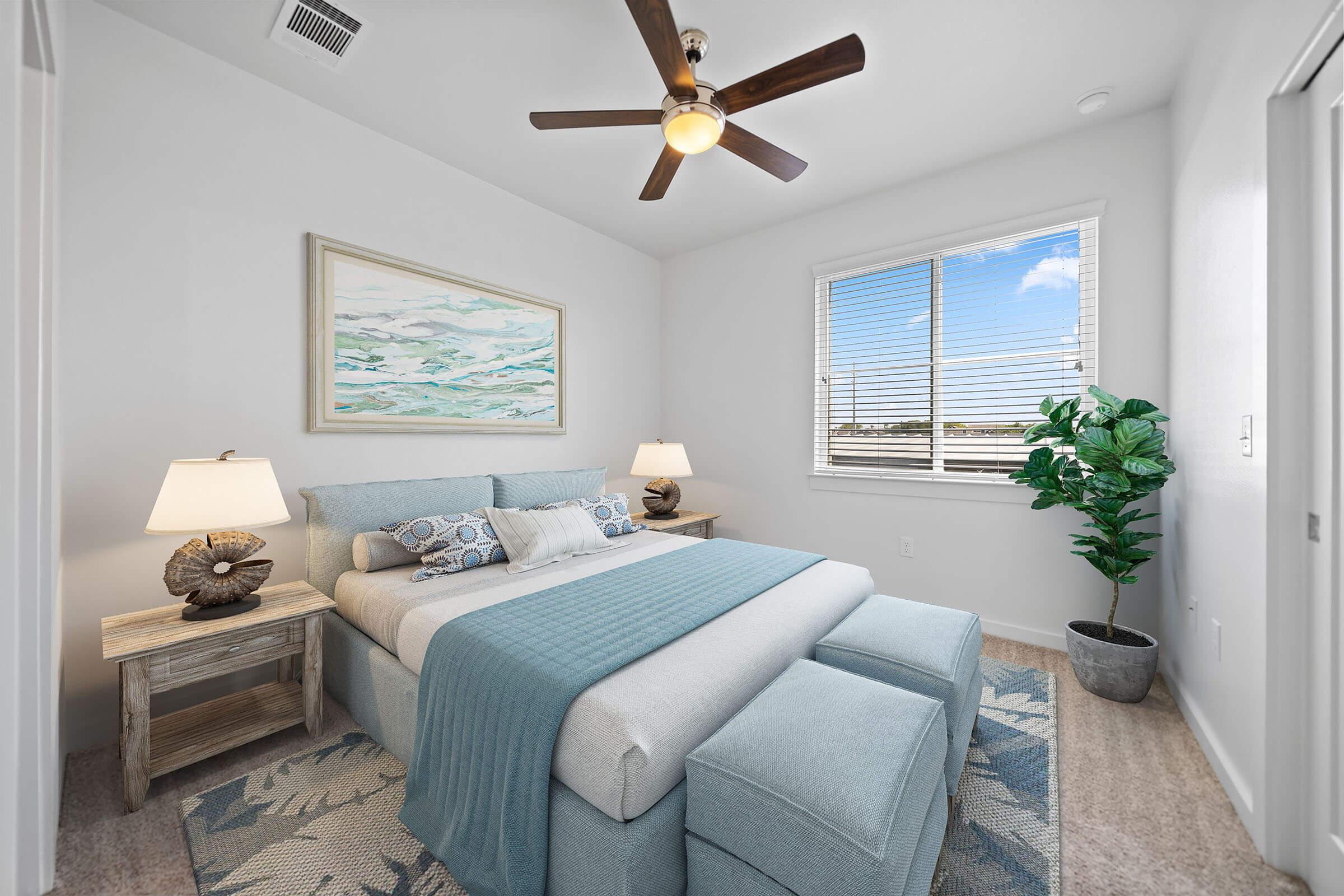 a bedroom with a large window