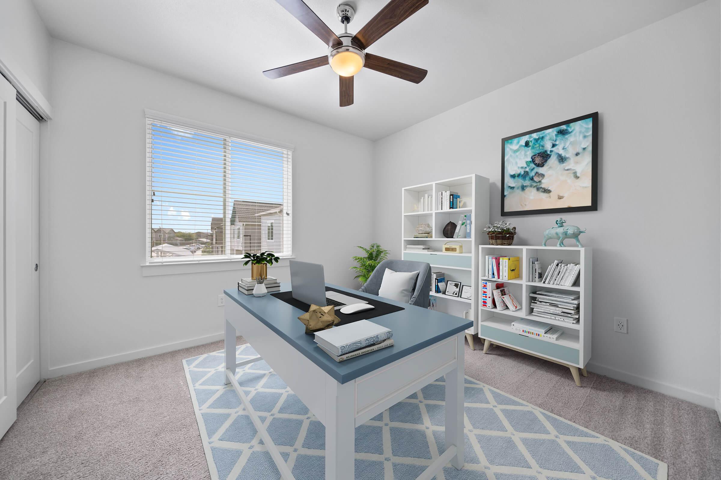 a living room filled with furniture and a large window