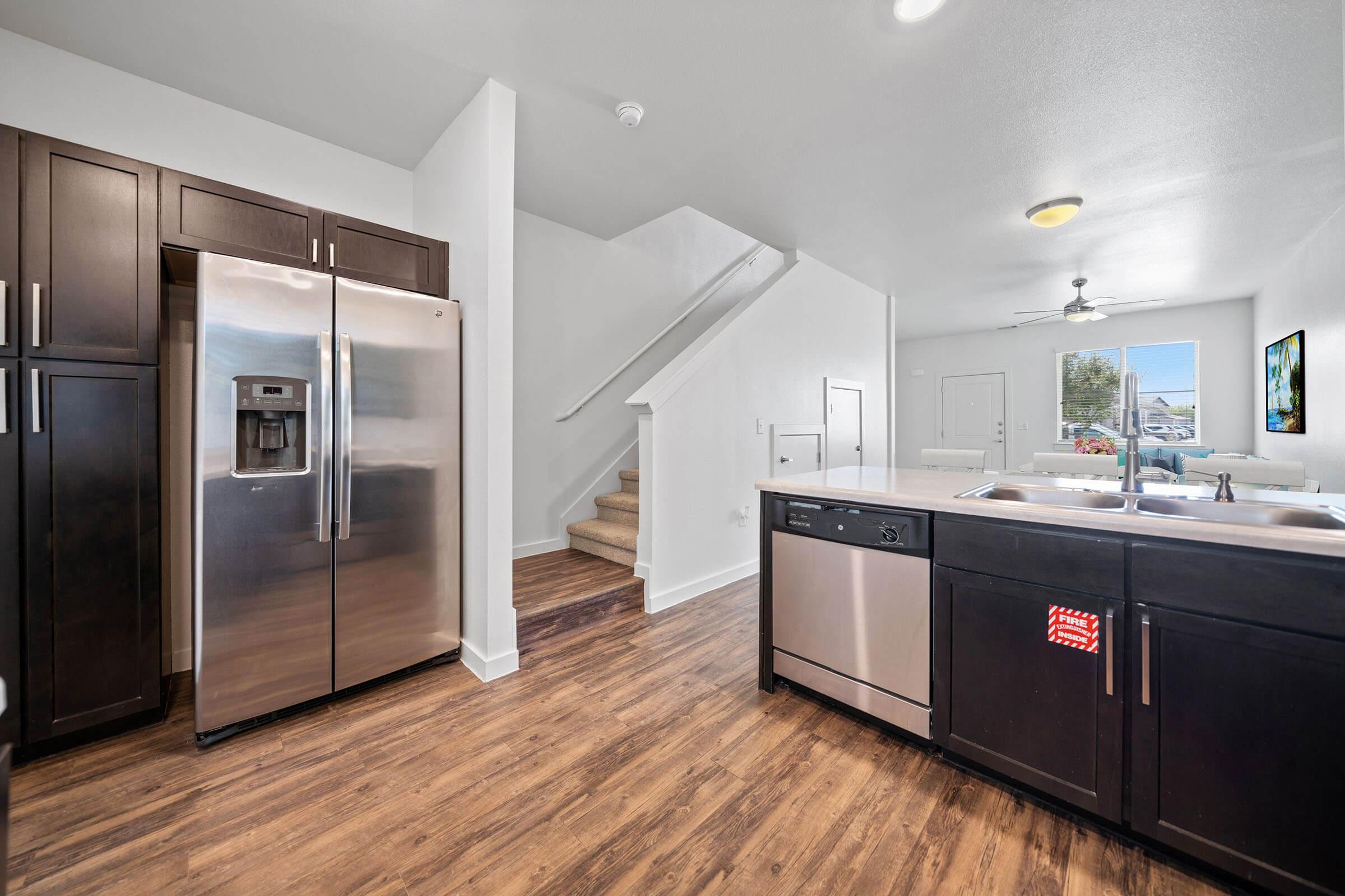 a large kitchen with stainless steel appliances