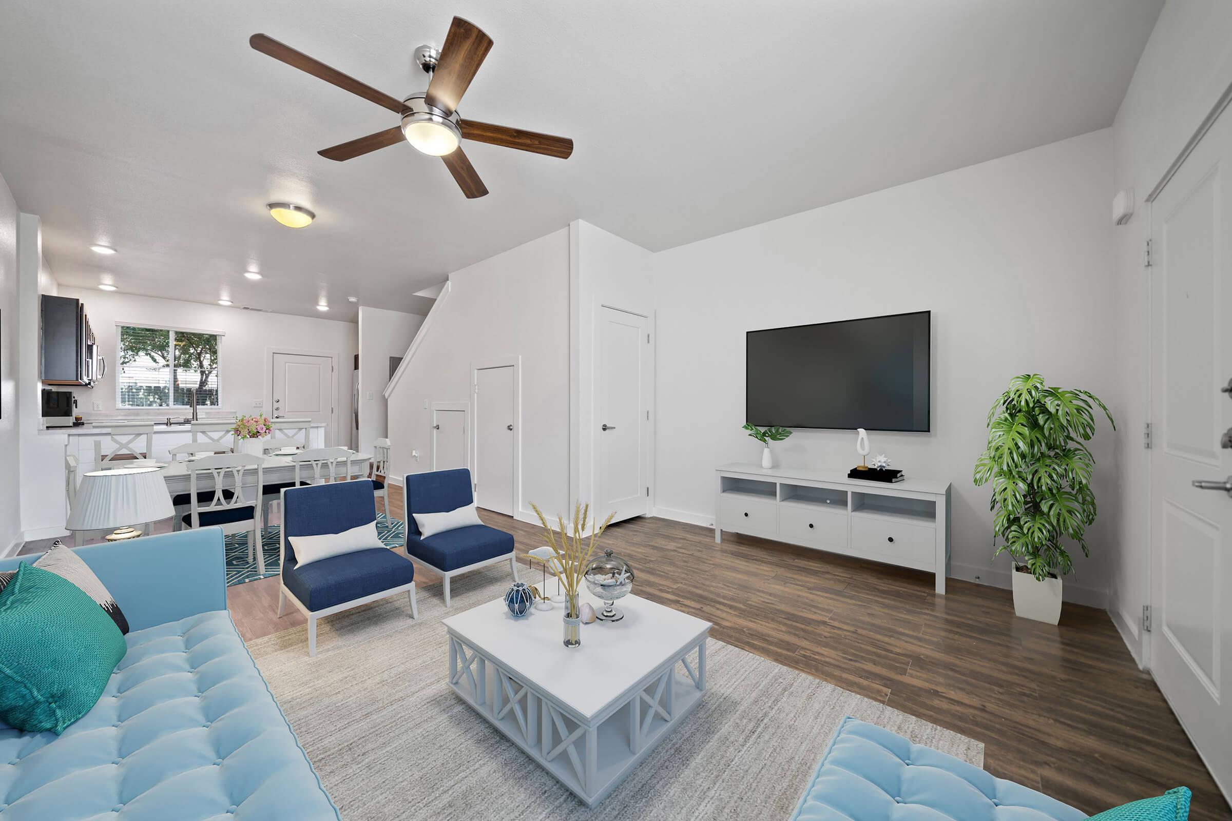 a living room filled with furniture and a tv