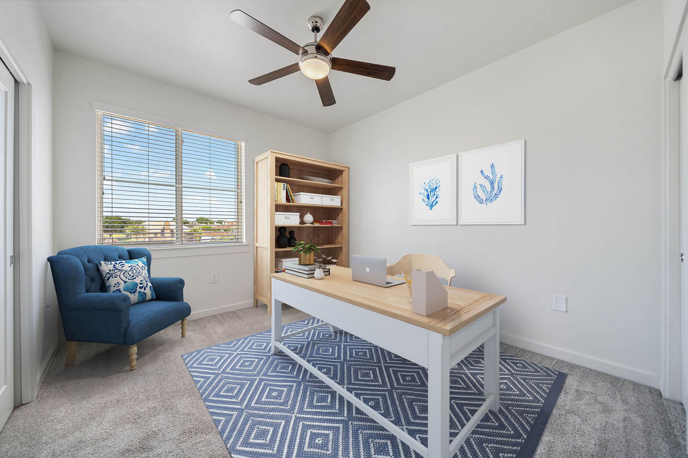 a living room filled with furniture and a large window