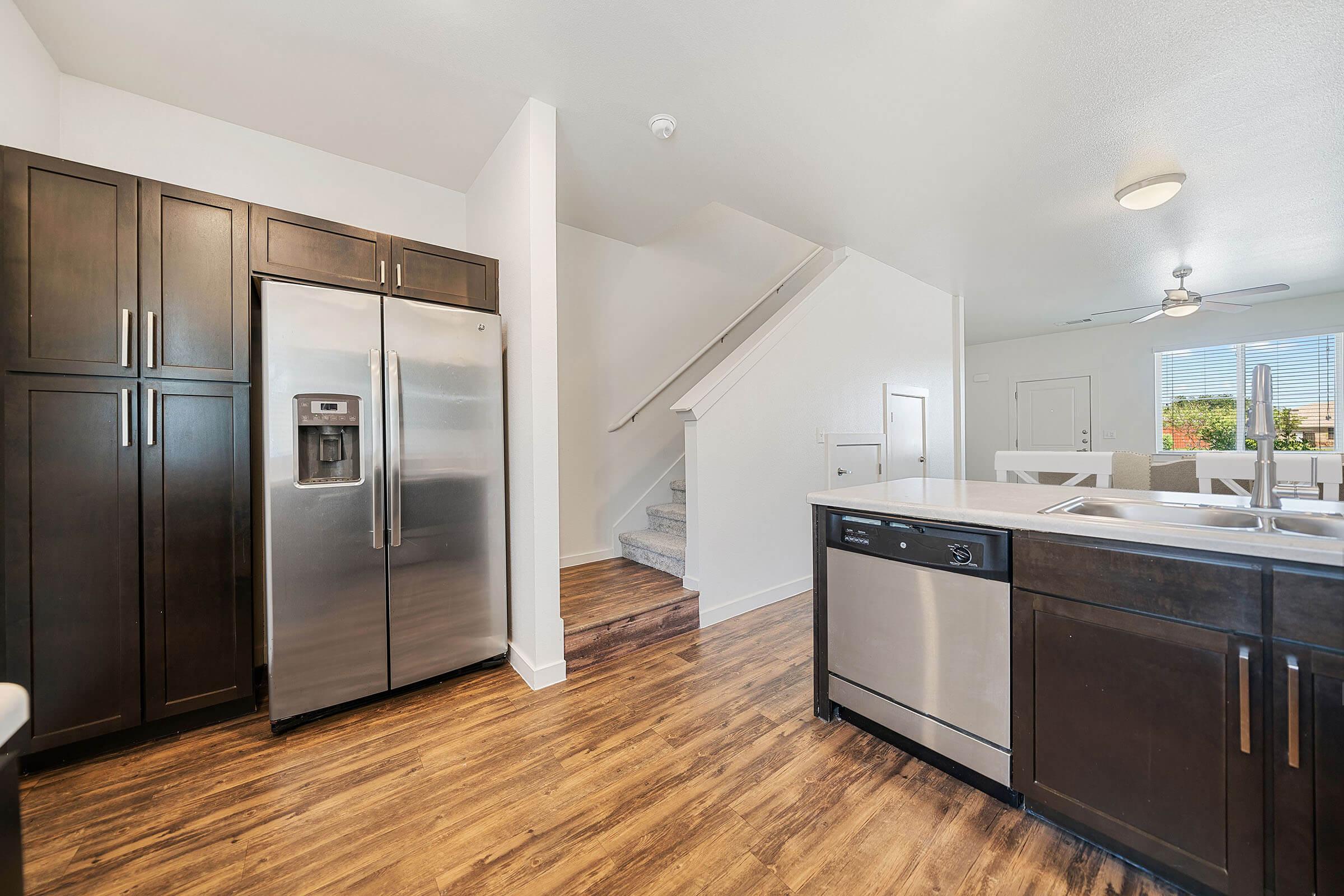 a large kitchen with stainless steel appliances