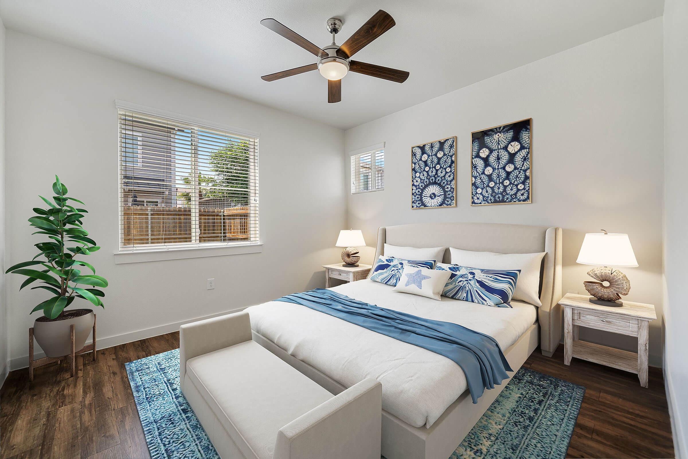 a living room with a bed and a window