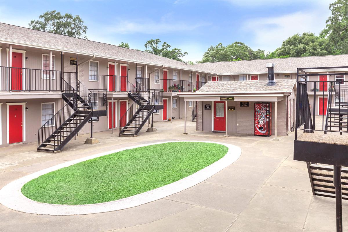 Villas at Park Place leasing office building with green grass