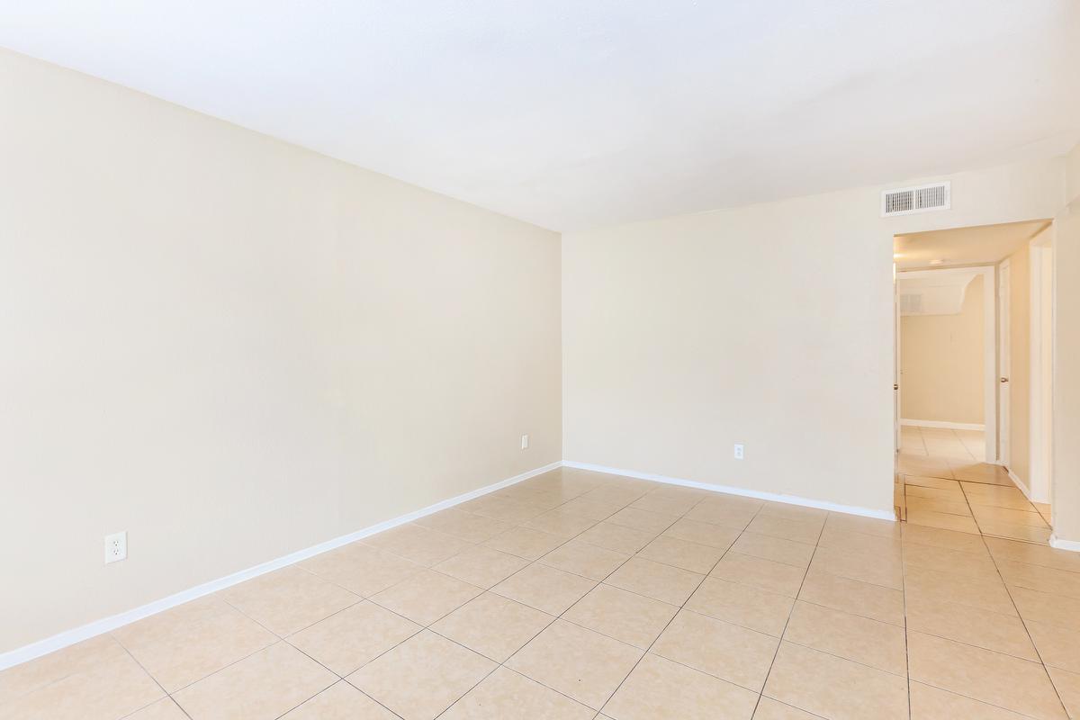 Unfurnished living room with tile floors