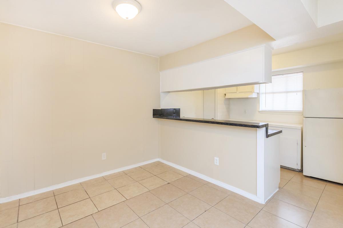 Dining room and kitchen with tile floors