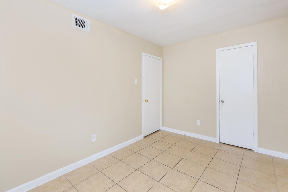 Bedroom with closed walk-in closet door